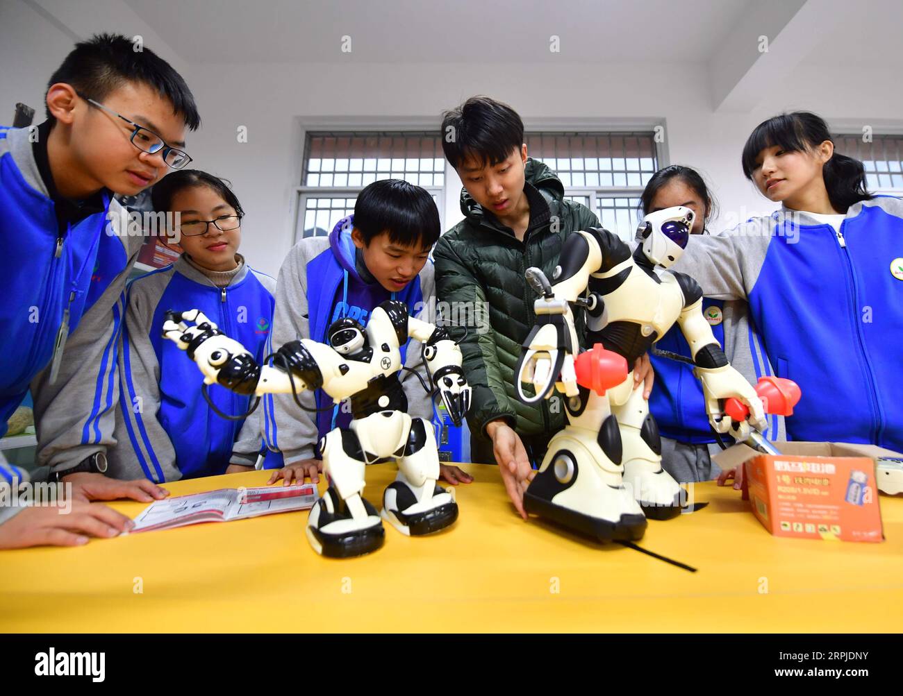 191206 -- RONGSHUI, Dec. 6, 2019 -- Guo Haokun 3rd R, a postgraduate student of Northwestern Polytechnical University NPU who volunteers here as a physics teacher, gives a class at a minority middle school in Rongshui Miao Autonomous County, south China s Guangxi Zhuang Autonomous Region, Dec. 5, 2019. Rongshui is among the 20 deeply impoverished counties in south China s Guangxi. Off its 115 poor villages, 73 are deeply impoverished. Since 2015, the NPU has launched educational assistance to the county where education level is low. Relying on its S&T as well as educational resources, the NPU Stock Photo