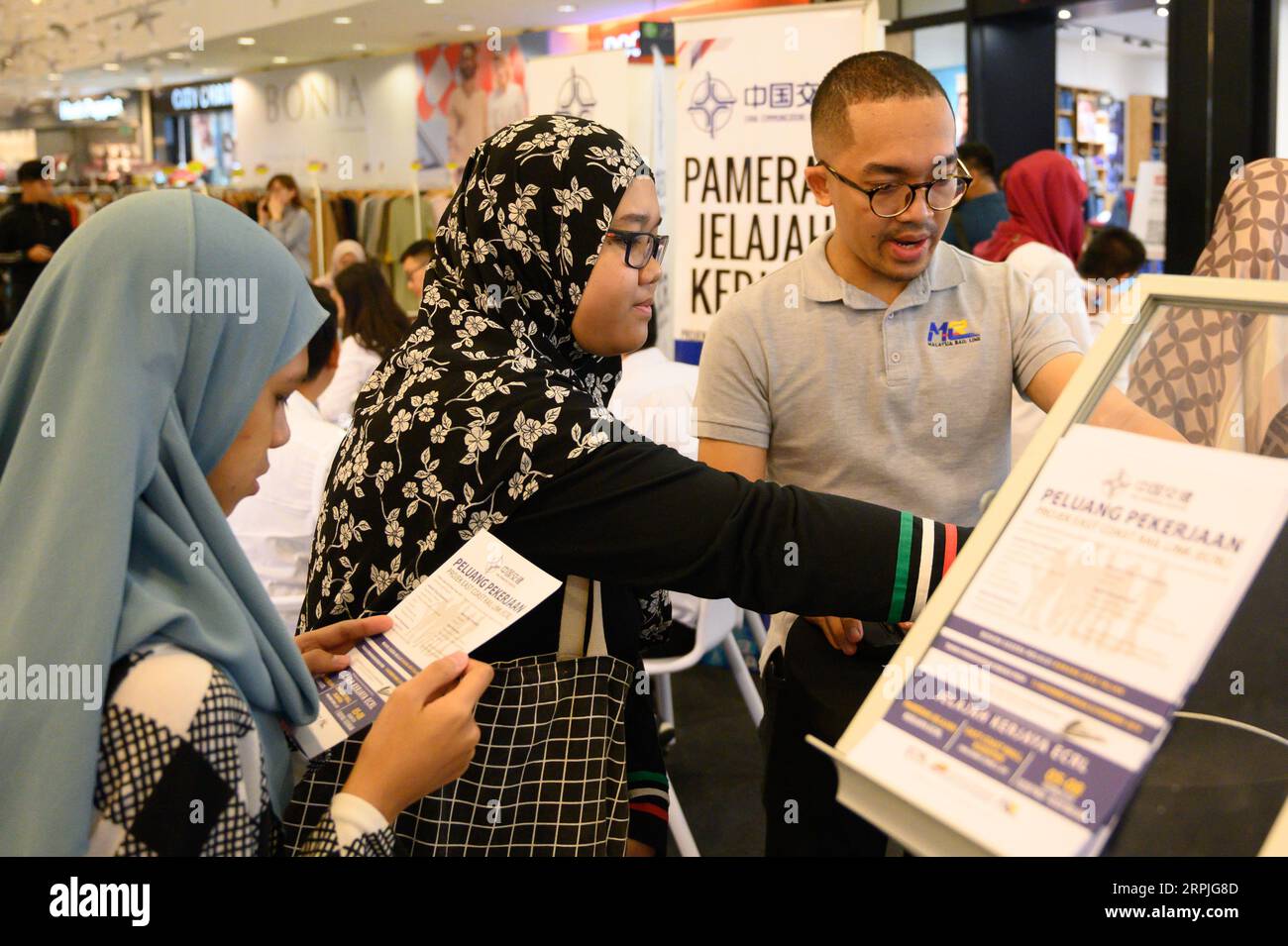 191209 -- KUANTAN, Dec. 9, 2019 -- Job-seekers attend a recruitment roadshow of the East Coast Rail Link ECRL, a major infrastructure project between China and Malaysia, in Kuantan, Malaysia, Dec. 6, 2019.  Xinhua Headlines: Railway megaproject ECRL creating new opportunities in Malaysia as construction picks up ZhuxWei PUBLICATIONxNOTxINxCHN Stock Photo