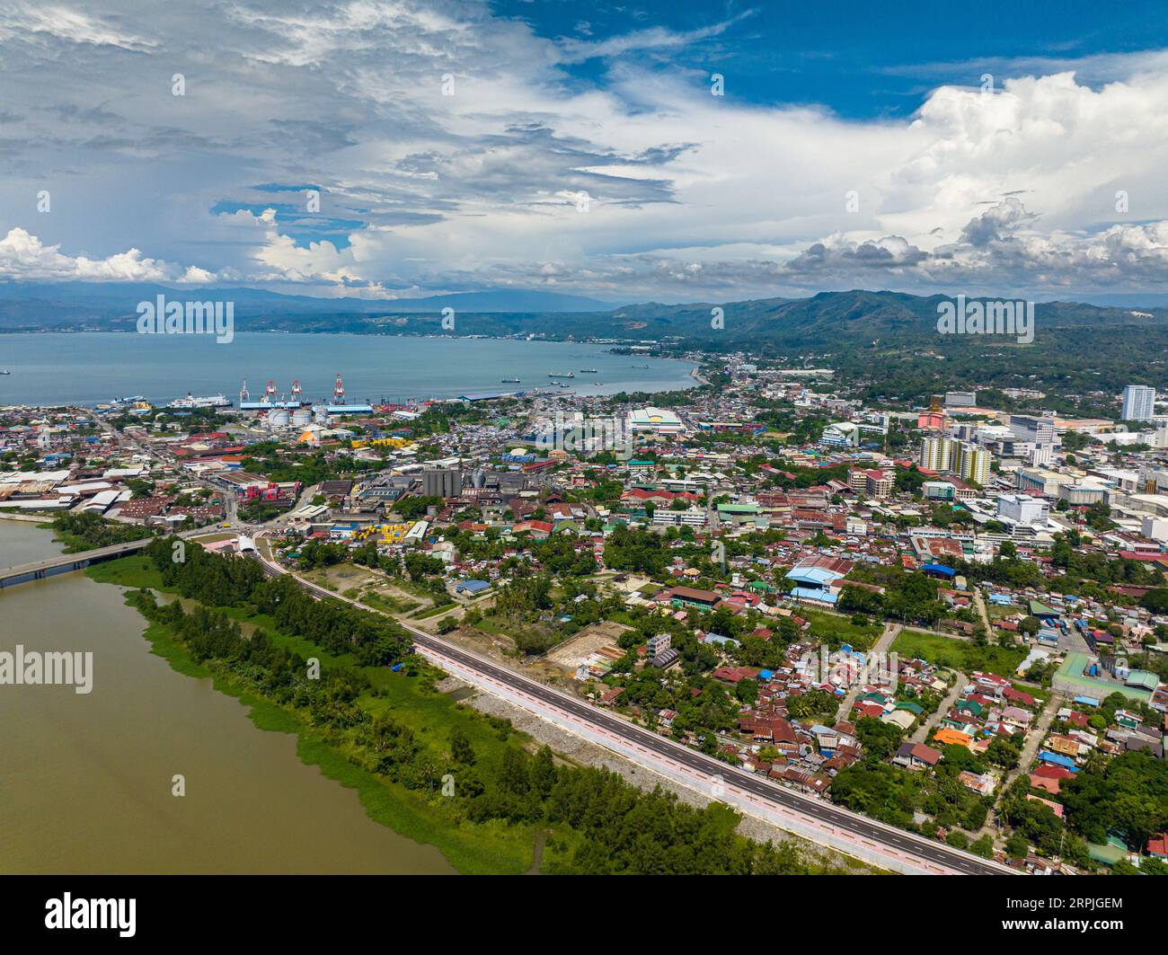 Coastline City with modern buildings and highway of Cagayan de Oro in Mindanao, Philippines. Stock Photo