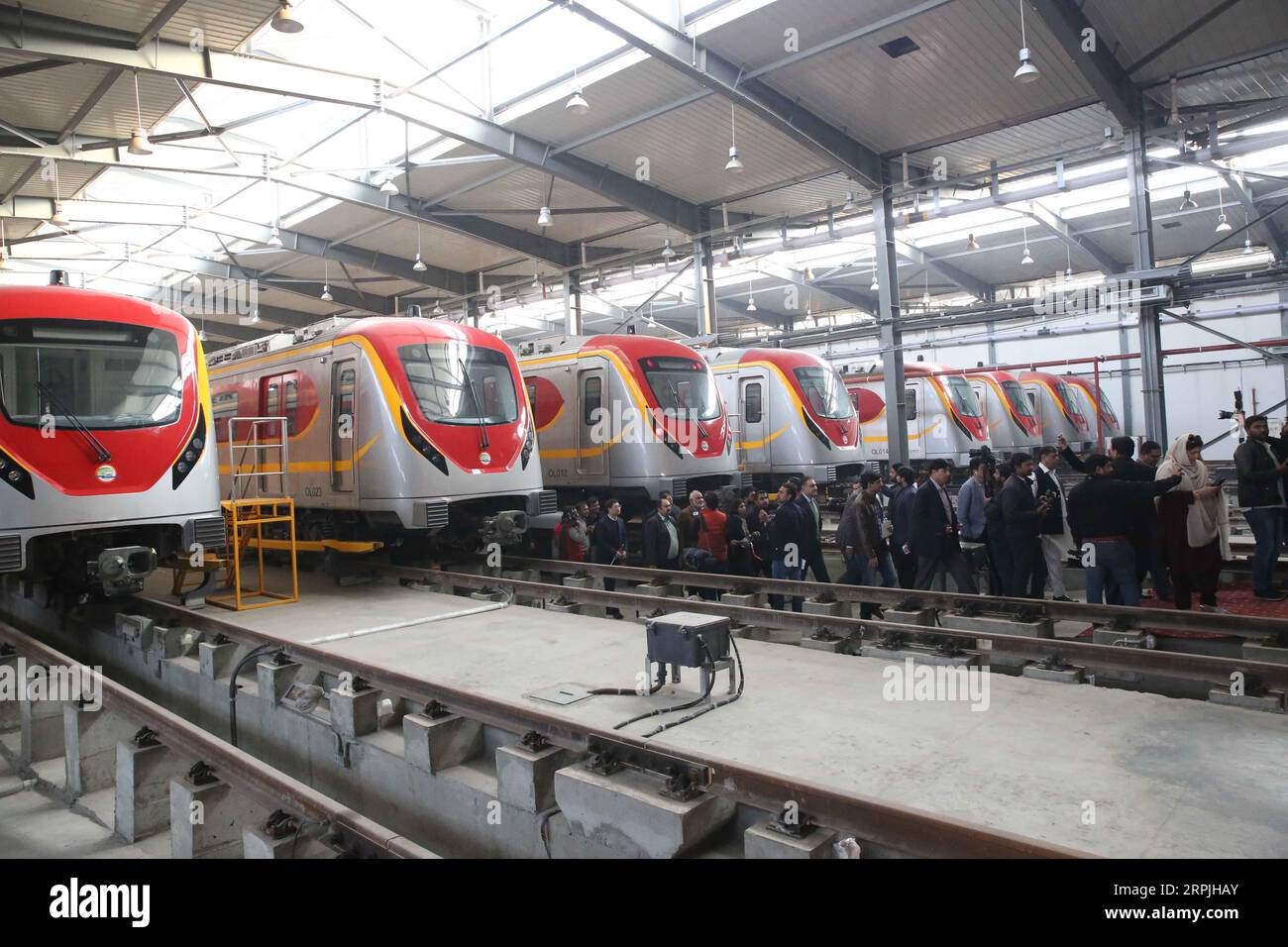 191211 -- LAHORE, Dec. 11, 2019 -- People walk out of a train during a test run of the Orange Line Metro Train in Lahore, Pakistan, on Dec. 10, 2019. Pakistan s first-ever mass rapid urban transit train took its first test run here on Tuesday after the completion of the physical infrastructure of the project under the China-Pakistan Economic Corridor CPEC.  PAKISTAN-LAHORE-CPEC-ORANGE LINE METRO TRAIN LiuxTian PUBLICATIONxNOTxINxCHN Stock Photo