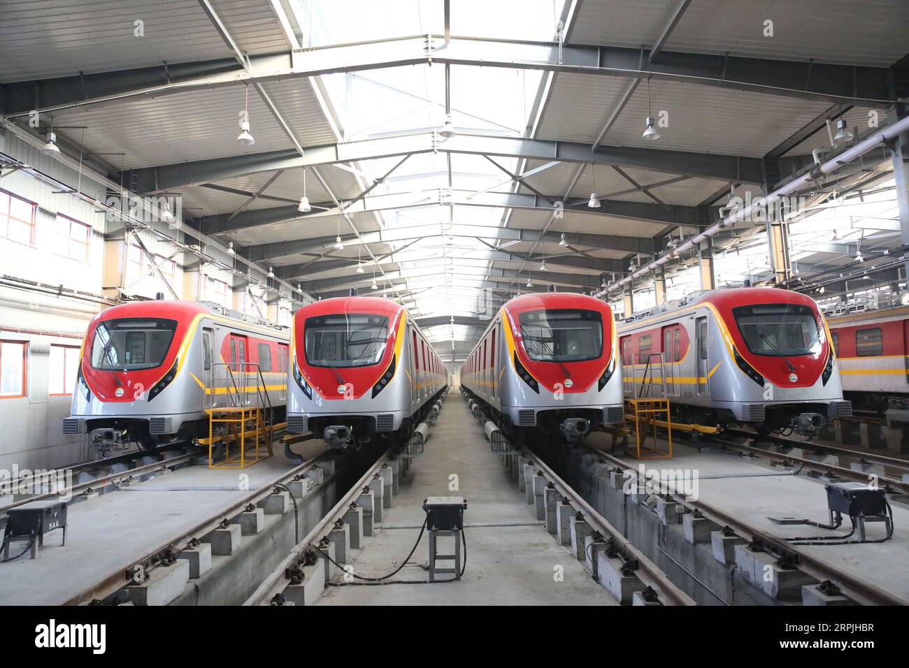 191211 -- LAHORE, Dec. 11, 2019 -- Trains of the metro train service are seen at a terminal station in Lahore, Pakistan, on Dec. 10, 2019. Pakistan s first-ever mass rapid urban transit train took its first test run here on Tuesday after the completion of the physical infrastructure of the project under the China-Pakistan Economic Corridor CPEC.  PAKISTAN-LAHORE-CPEC-ORANGE LINE METRO TRAIN LiuxTian PUBLICATIONxNOTxINxCHN Stock Photo