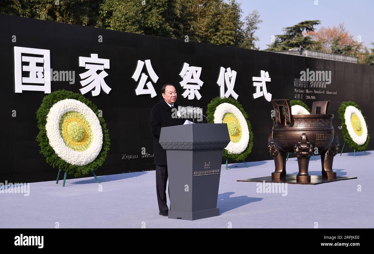 191213 -- NANJING, Dec. 13, 2019 -- Huang Kunming, a member of the Political Bureau of the Communist Party of China CPC Central Committee and head of the Publicity Department of the CPC Central Committee, speaks at a national memorial ceremony to mourn the 300,000 victims of the Nanjing Massacre in Nanjing, east China s Jiangsu Province, Dec. 13, 2019.  CHINA-NANJING MASSACRE VICTIMS-HUANG KUNMING-NATIONAL MEMORIAL CEREMONY CN LixXiang PUBLICATIONxNOTxINxCHN Stock Photo