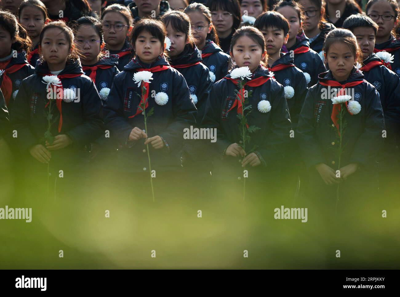 191213 -- NANJING, Dec. 13, 2019 -- People mourn victims of the Nanjing Massacre during a ceremony to mark China s sixth National Memorial Day for Nanjing Massacre victims at the Monument for the victims killed at the Zhongshan Dock in the massacre in Nanjing, east China s Jiangsu Province, Dec. 13, 2019.  CHINA-NANJING MASSACRE VICTIMS-NATIONAL MEMORIAL CEREMONY CN LixYuze PUBLICATIONxNOTxINxCHN Stock Photo