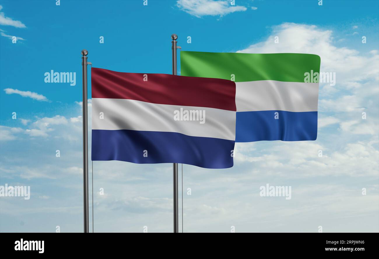 Sierra Leone or Salone and Netherlands flag waving together in the wind on blue sky, two country cooperation concept Stock Photo