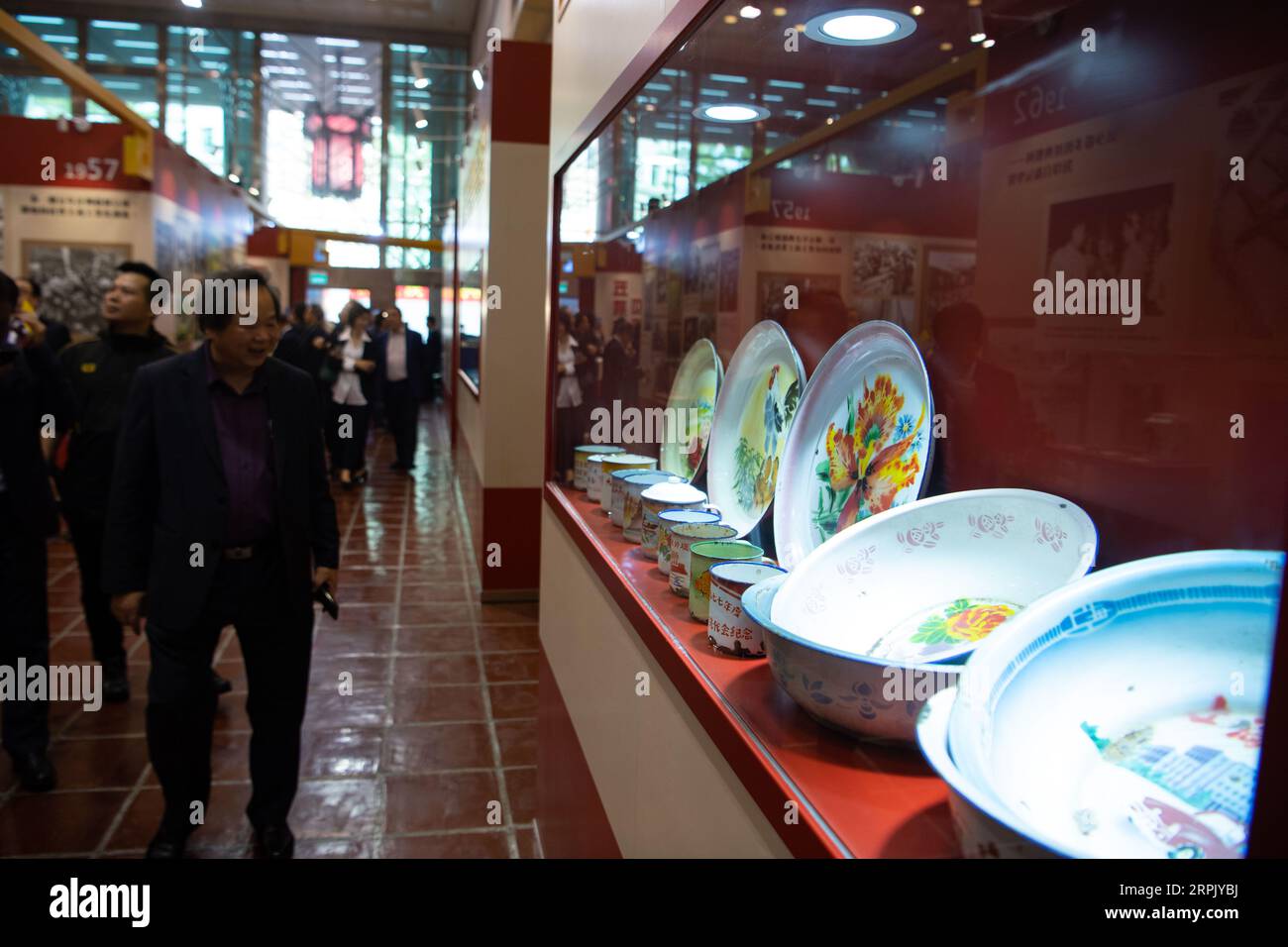 191222 -- MACAO, Dec. 22, 2019 Xinhua -- Visitors view an exhibition marking the 70th anniversary of the founding of the People s Republic of China PRC in south China s Macao, Dec. 22, 2019. The exhibition opened here on Sunday, displaying more than 600 historical pictures and more than 300 exhibits in chronological order. Xinhua/Cheong Kam Ka CHINA-MACAO-70TH ANNIVERSARY-CHINA-FOUNDING-EXHIBITION CN PUBLICATIONxNOTxINxCHN Stock Photo