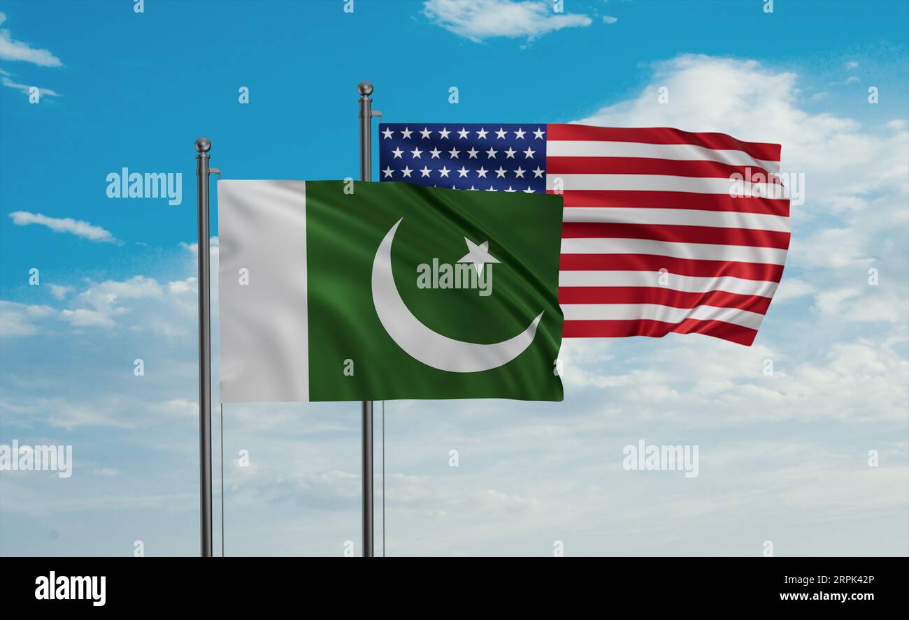 USA and Pakistan flag waving together in the wind on blue sky, two country cooperation concept Stock Photo