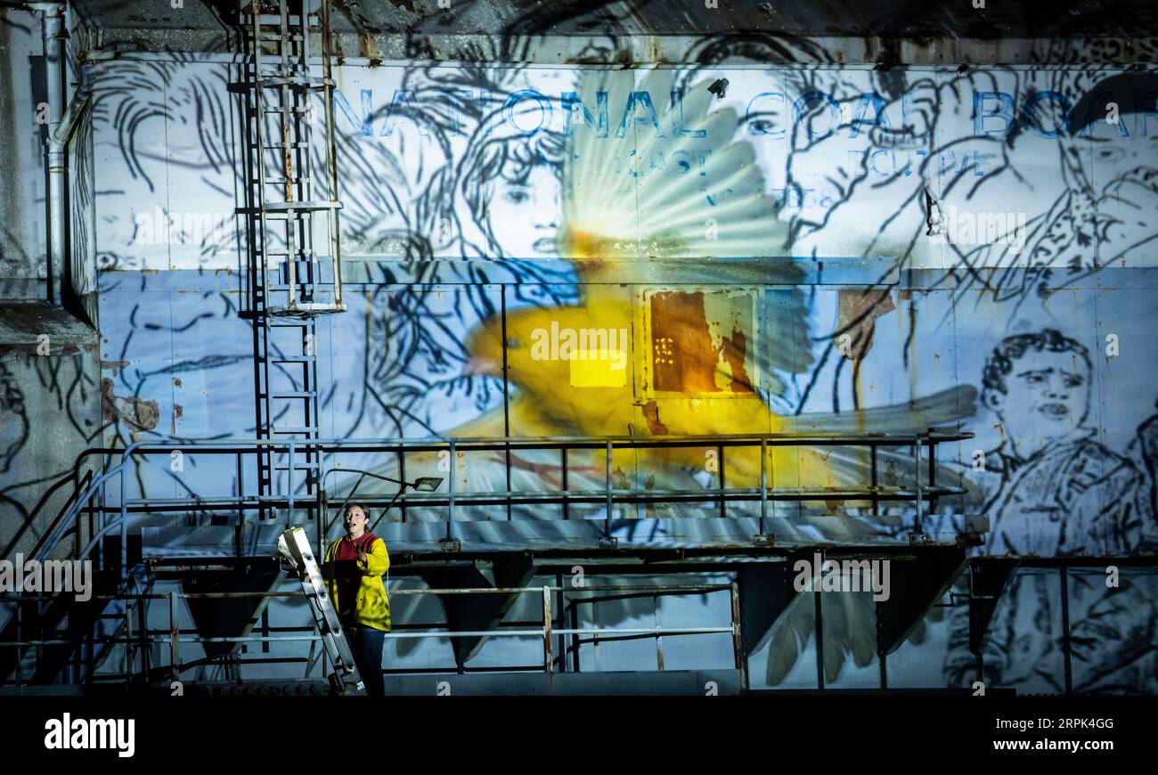An actor during against a projection during the dress rehearsal for ...