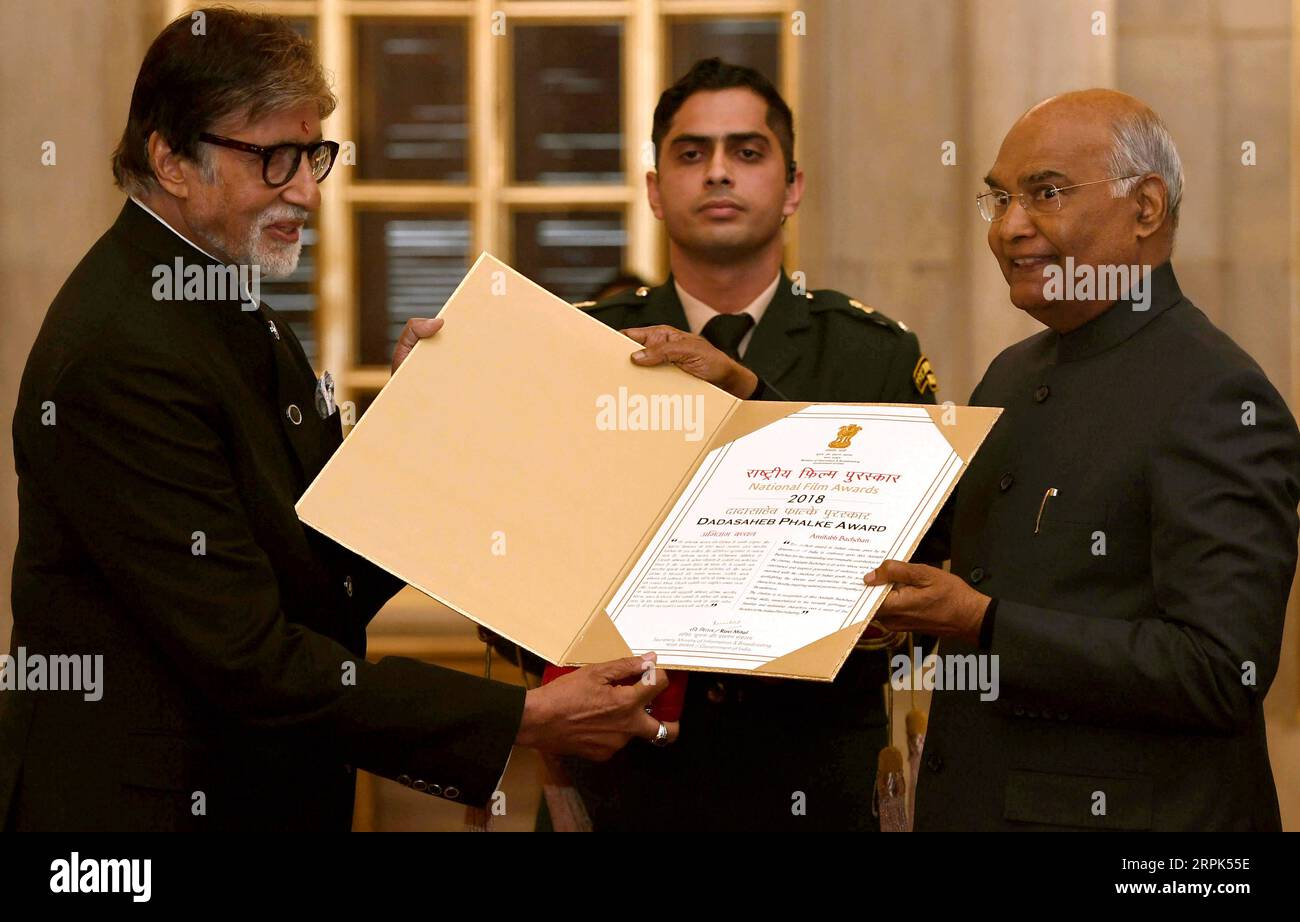 191230 -- NEW DELHI, Dec. 30, 2019 -- Indian President Ram Nath Kovind R presents Dadasaheb Phalke award to Indian superstar and veteran actor Amitabh Bachchan L during a function at the Indian presidential palace in New Delhi, India on Dec. 29, 2019. Amitabh Bachchan was Sunday honoured with the country s top cinema award -- Dadasaheb Phalke award for his outstanding contribution to the film industry, officials said. Str/Xinhua INDIA-NEW DELHI-AMITABH BACHCHAN-TOP CINEMA AWARD Stringer PUBLICATIONxNOTxINxCHN Stock Photo