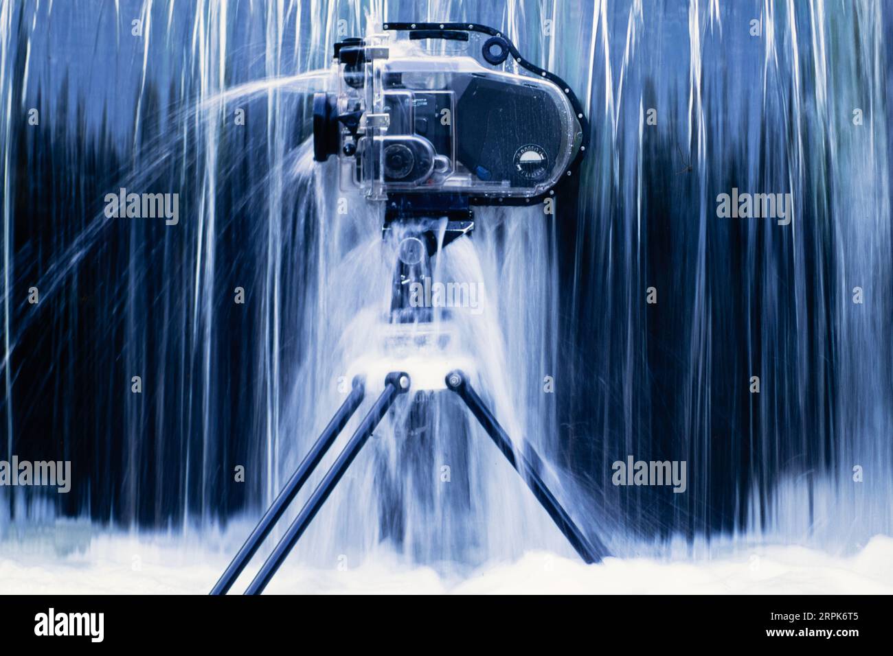 Still life of a film camera in underwater housing placed underneath a waterfall Stock Photo Alamy