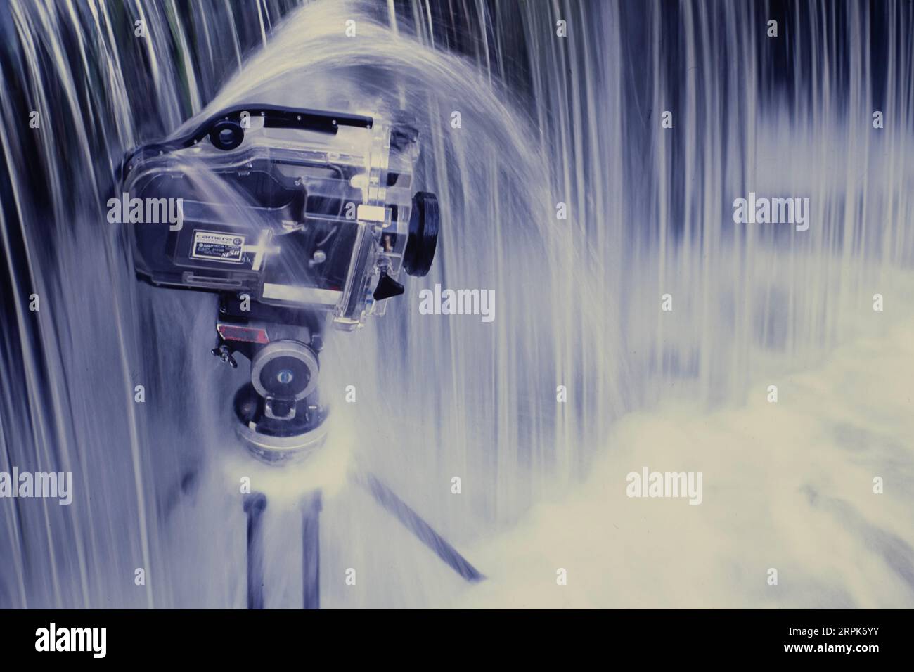 Still life of a film camera in underwater housing placed underneath a waterfall Stock Photo Alamy