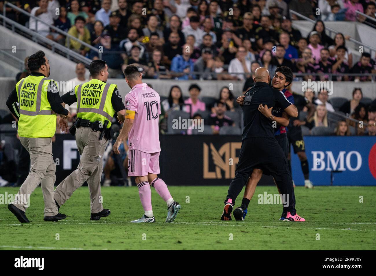 A fan of Inter Miami forward Lionel Messi (10) is detained by security during a MLS match against LAFC, Sunday, September 3, 2023, at the BMO Stadium, Stock Photo