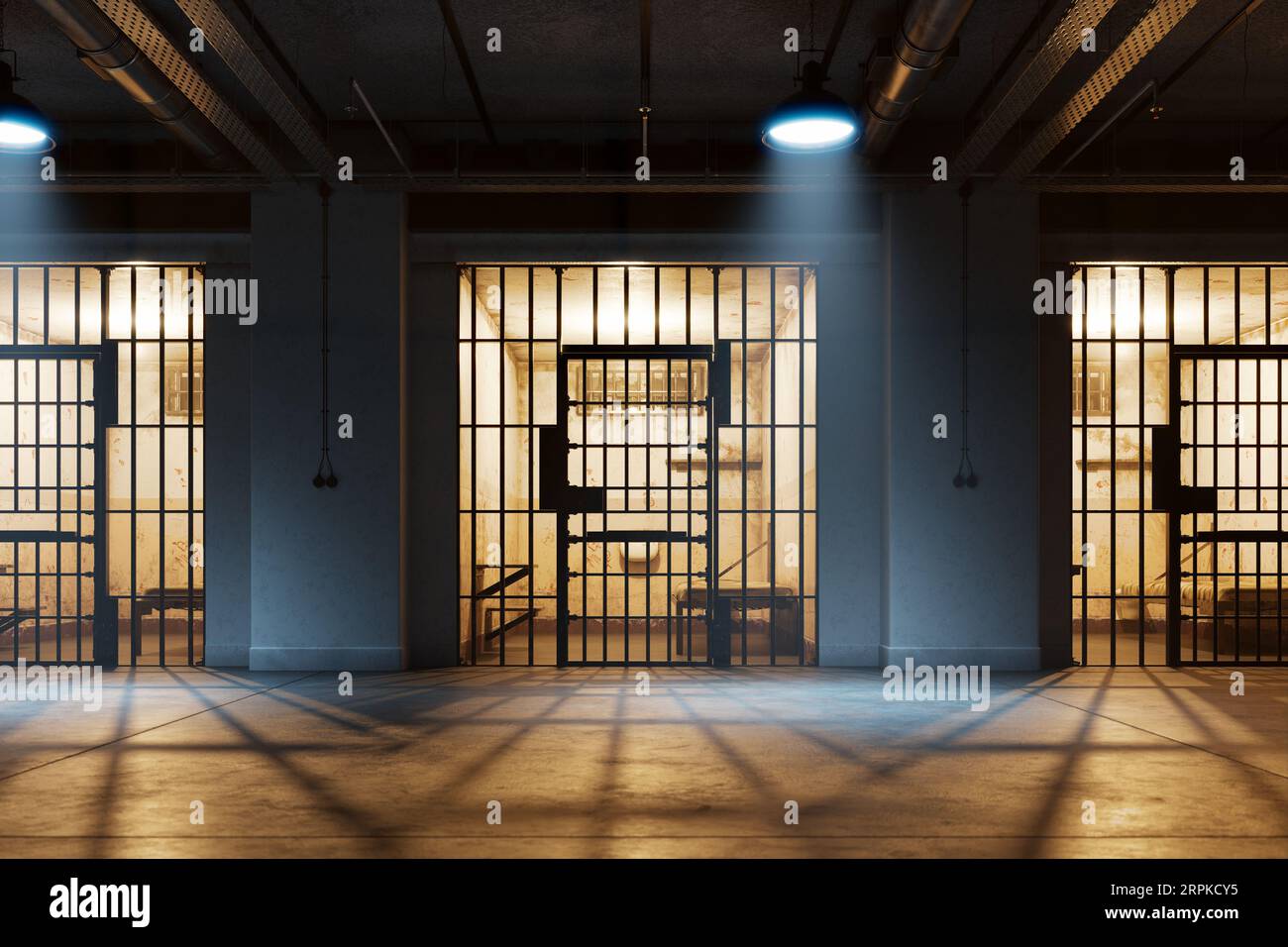 The gloomy interior of a single occupancy cells in an old jail. Life behind bars Stock Photo