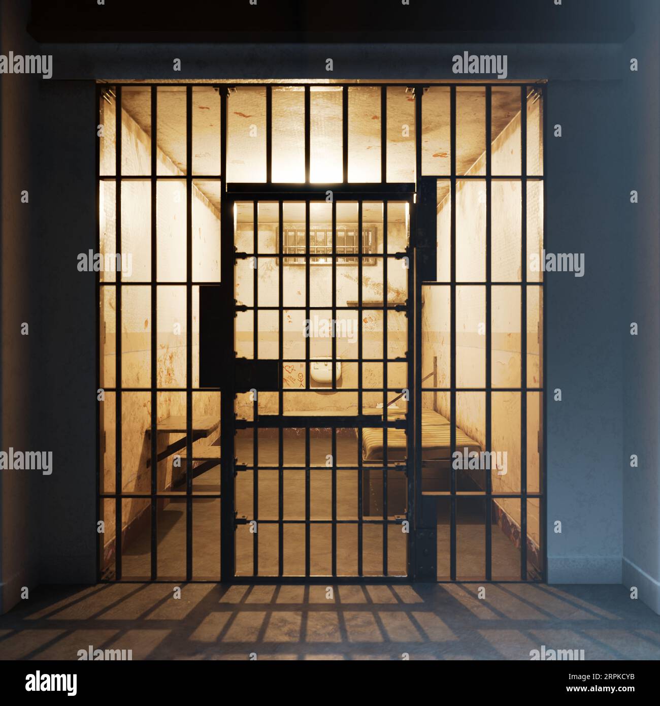 The gloomy interior of a single occupancy cell in an old jail. Life behind bars Stock Photo