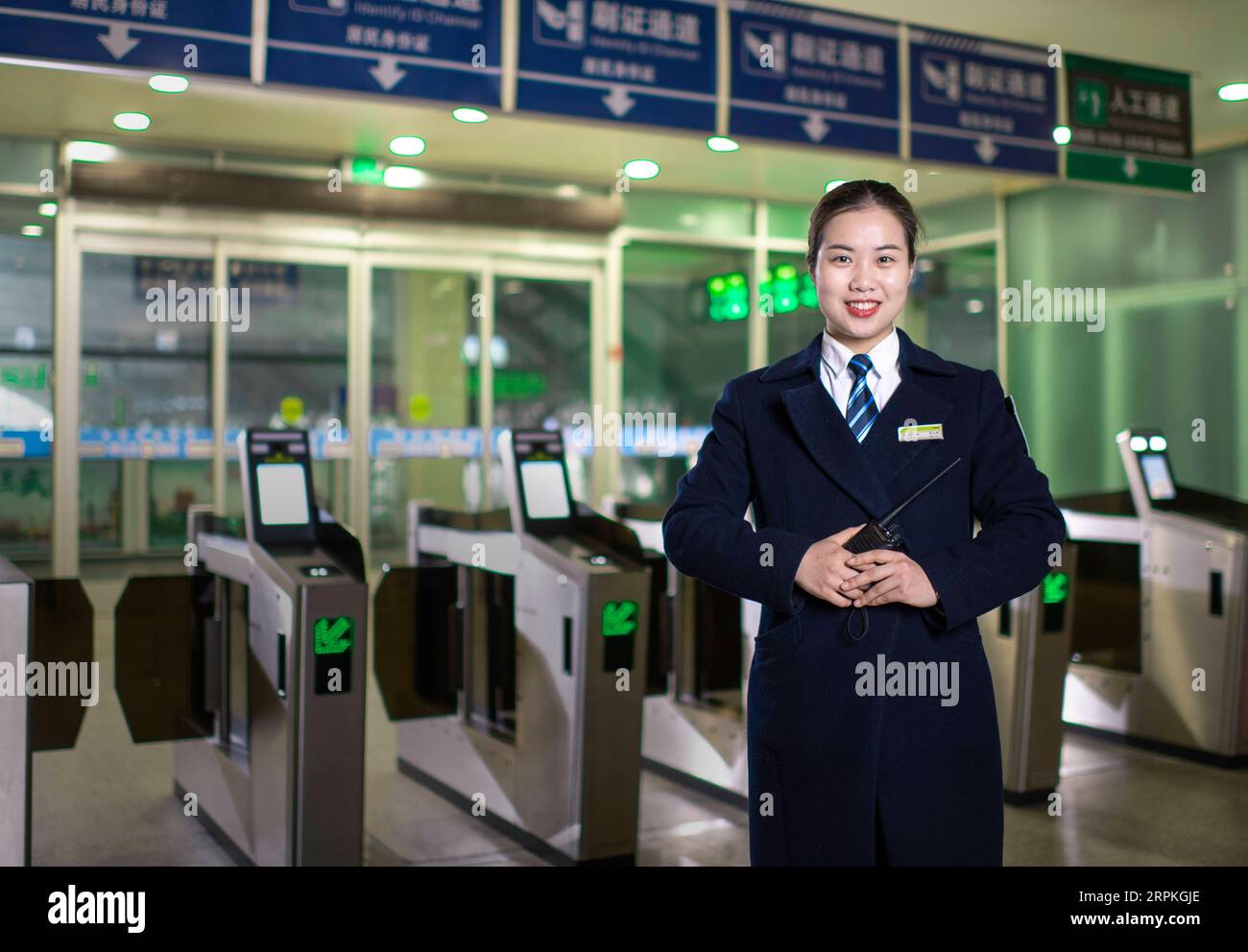 200111 -- WUHAN, Jan. 11, 2020 -- Sun Fanjun, a ticket inspector, poses for a photo at Hankou Railway Station in Wuhan, central China s Hubei Province, Jan. 5, 2020. China, the world s most populated country, on Jan. 10 ushered in its largest annual migration, 15 days ahead of the Spring Festival, or the Lunar New Year. This year, three billion trips will be made during the travel rush from Jan. 10 to Feb. 18 for family reunions and travel, according to official forecast. The 40-day travel rush is known as Chunyun in Chinese. The Lunar New Year falls on Jan. 25 this year, earlier than previous Stock Photo