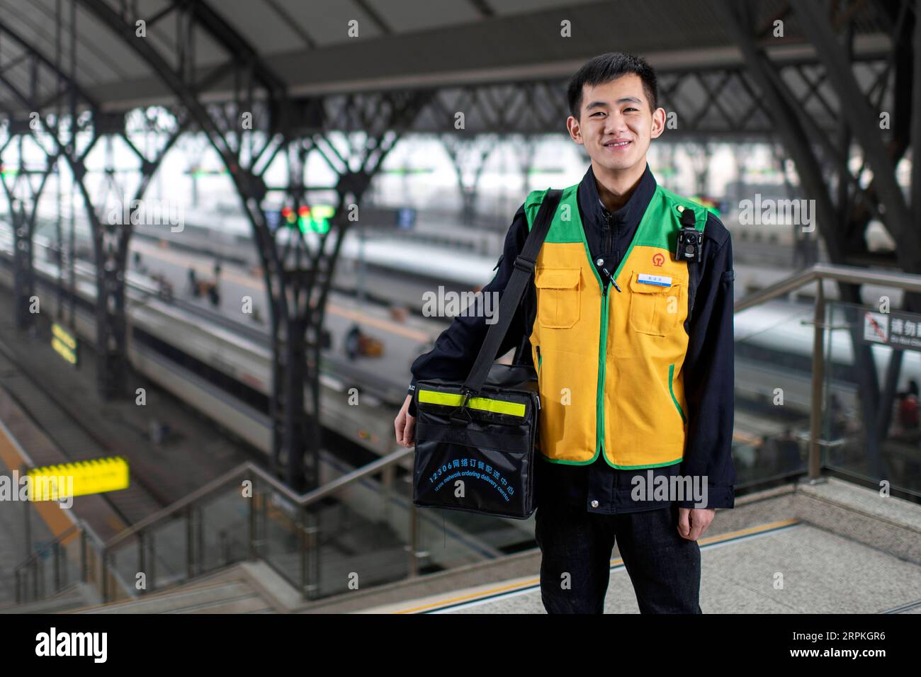 200111 -- WUHAN, Jan. 11, 2020 -- Ye Sheng, a food deliveryman for bullet train passengers, poses for a photo at Hankou Railway Station in Wuhan, central China s Hubei Province, Jan. 5, 2020. China, the world s most populated country, on Jan. 10 ushered in its largest annual migration, 15 days ahead of the Spring Festival, or the Lunar New Year. This year, three billion trips will be made during the travel rush from Jan. 10 to Feb. 18 for family reunions and travel, according to official forecast. The 40-day travel rush is known as Chunyun in Chinese. The Lunar New Year falls on Jan. 25 this y Stock Photo