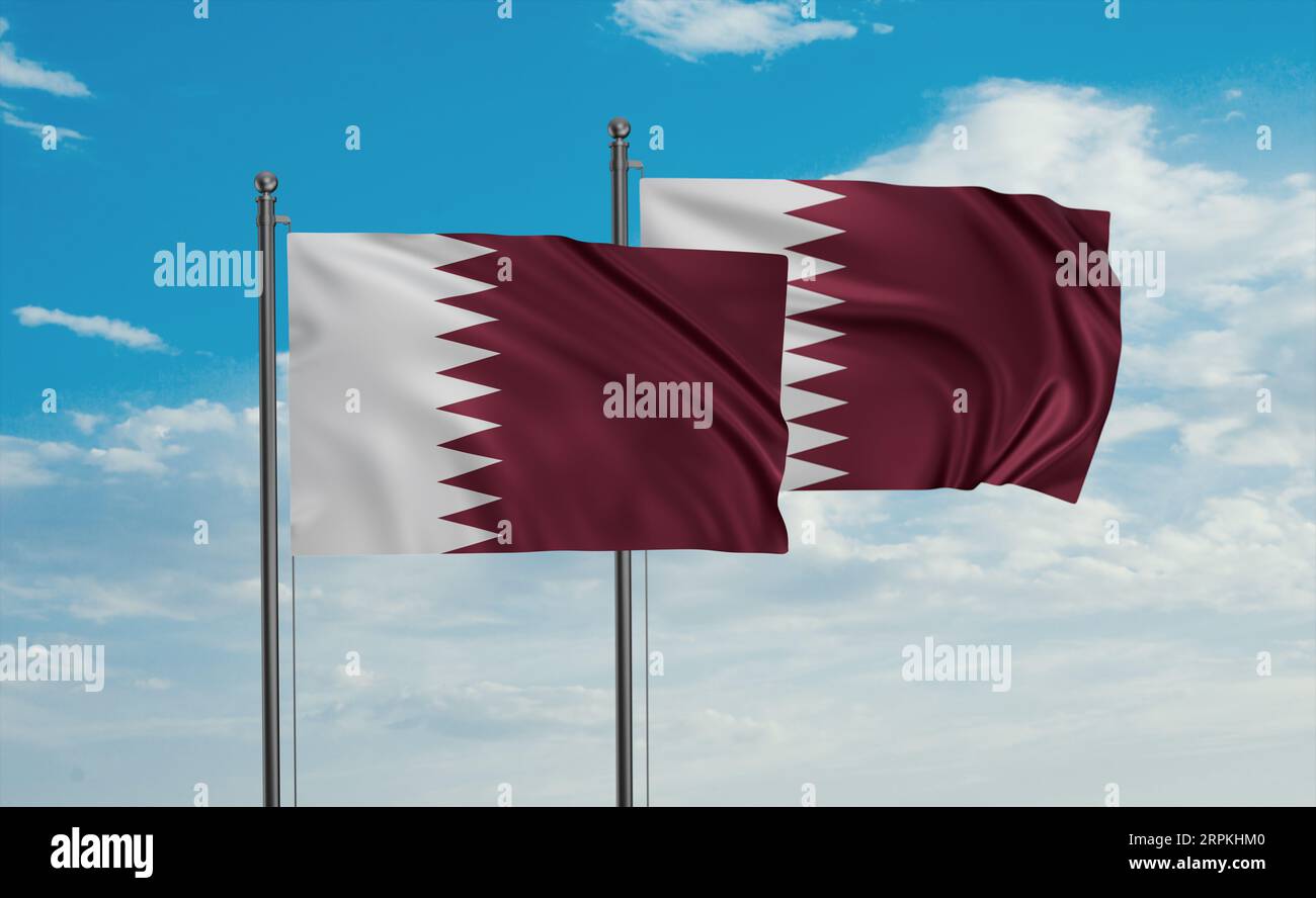 Two Qatar flags waving together in the wind on blue sky, two country ...
