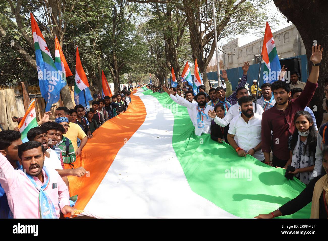 200113 -- BANGALORE, Jan. 13, 2020 -- Students from various colleges under the aegis of National Students Union of India NSUI hold a national flag during a protest rally against the assault on the students of the Delhi-based Jawaharlal Nehru University JNU and various other universities across India, in Bangalore, India, Jan. 13, 2020. Str/Xinhua INDIA-BANGALORE-PROTEST XinxHuashe PUBLICATIONxNOTxINxCHN Stock Photo