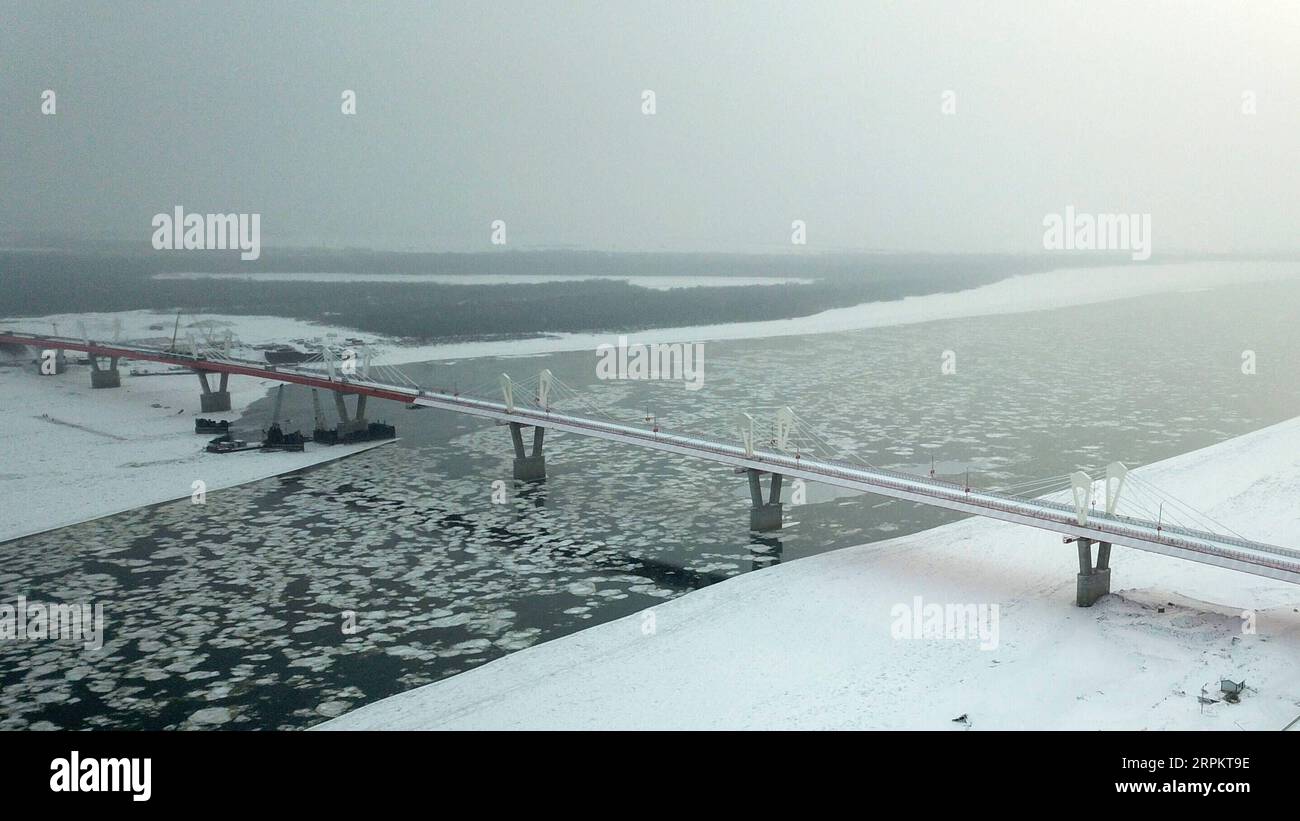 200117 -- HARBIN, Jan. 17, 2020 -- Aerial photo taken on Dec. 2, 2019 shows the first highway bridge connecting China and Russia across the Heilongjiang River. The first highway bridge connecting China and Russia across the Heilongjiang River has recently passed the final acceptance test, the department of transport of northeast China s Heilongjiang Province said Friday. Measuring 1,284 meters long and 14.5 meters wide, the bridge across the Heilongjiang River, known in Russia as the Amur River, stretches from Heihe, a border city in Heilongjiang Province, to the Russian city of Blagoveshchens Stock Photo