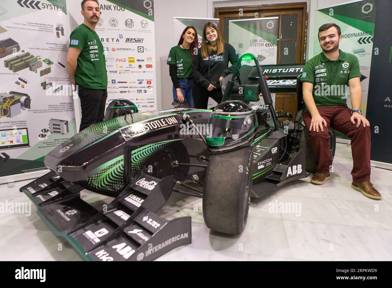 200118 -- ATHENS, Jan. 18, 2020 -- Students of Aristotle University of Thessaloniki pose for photos with their electric race car during the Eco-Fest 2020 event in Athens, Greece, on Jan. 18, 2020. The three-day Eco-Fest 2020 was opened here on Saturday, aiming to introduce innovative products, new technologies and cutting-edge services in electric, energy and recycling sectors.  GREECE-ATHENS-ECO-FEST 2020 MariosxLolos PUBLICATIONxNOTxINxCHN Stock Photo