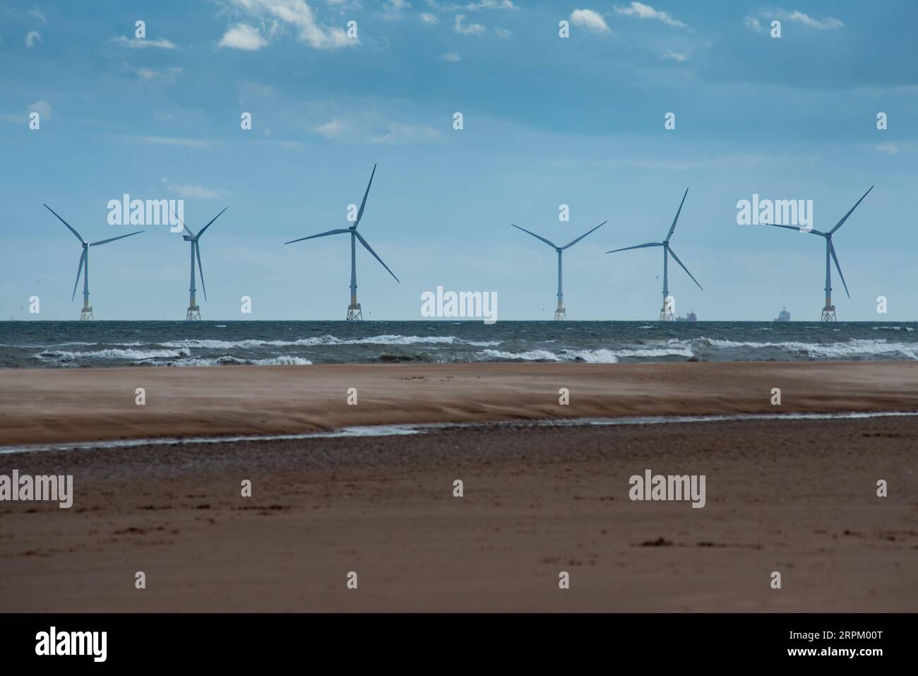 An aerial view of a wind turbine along the coastline Stock Photo - Alamy
