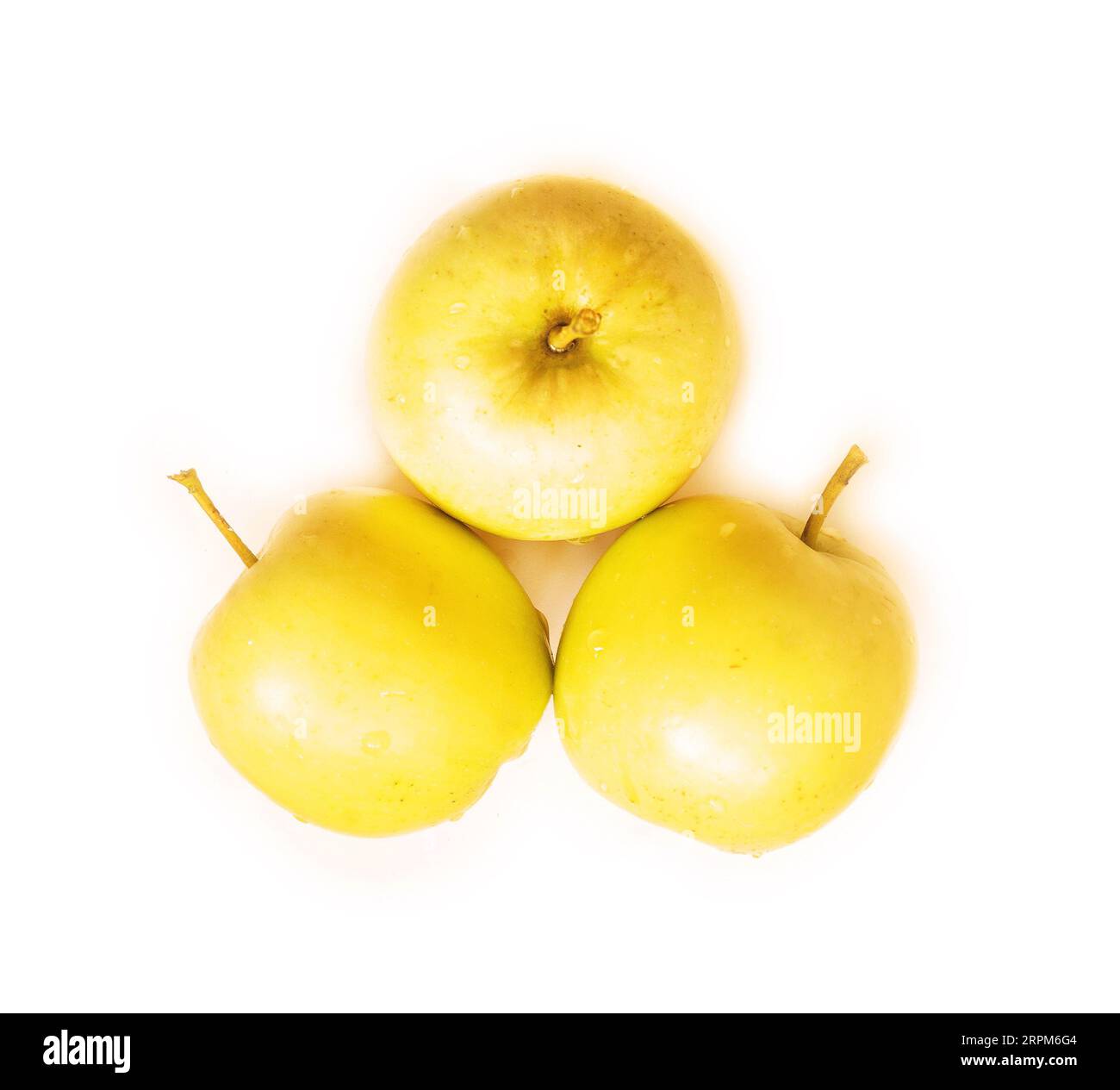 wet golden apples isolated on white Stock Photo