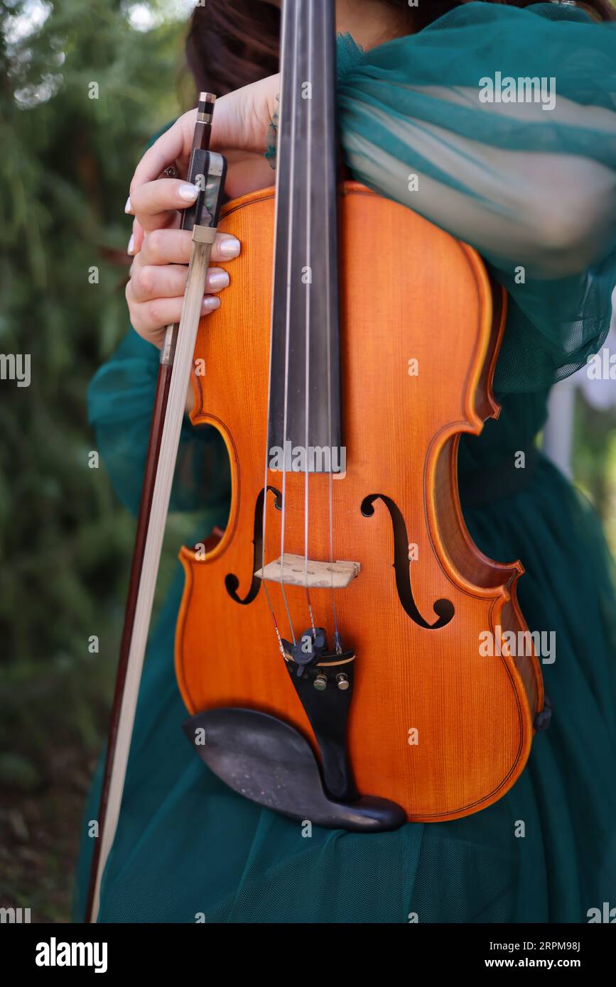 Young woman playing a violin hi-res stock photography and images - Alamy
