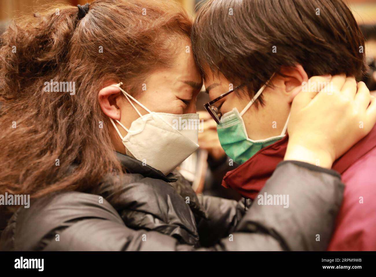 200205 -- LANZHOU, Feb. 5, 2020 -- Dong Huimin R, a member of the medical team, says goodbye to her colleague before leaving for Wuhan, the epicenter of the coronavirus outbreak, in Lanzhou, northwest China s Gansu Province, Feb. 4, 2020. The second batch of a medical team comprised of 100 members from Gansu Province left for Wuhan in the early morning on Wednesday to aid the novel coronavirus control efforts there. Photo by /Xinhua CHINA-GANSU-MEDICAL TEAM-AID-SECOND BATCH CN DuxZheyu PUBLICATIONxNOTxINxCHN Stock Photo