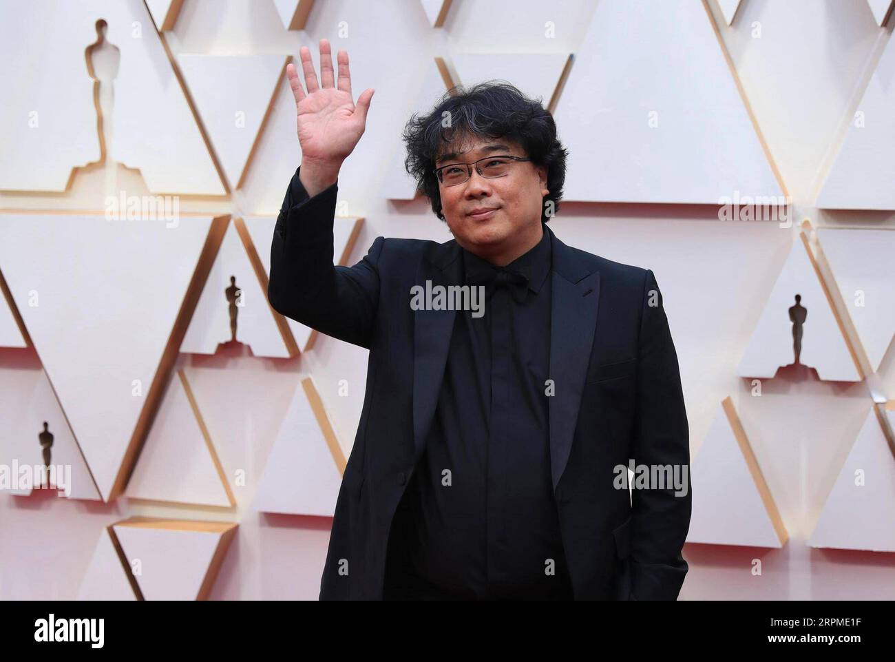 Parasite director Bong Joon Ho and cast members walking on the red carpet  at the 92nd Annual Academy Awards held at the Dolby Theatre in Hollywood,  California on Feb. 9, 2020. (Photo