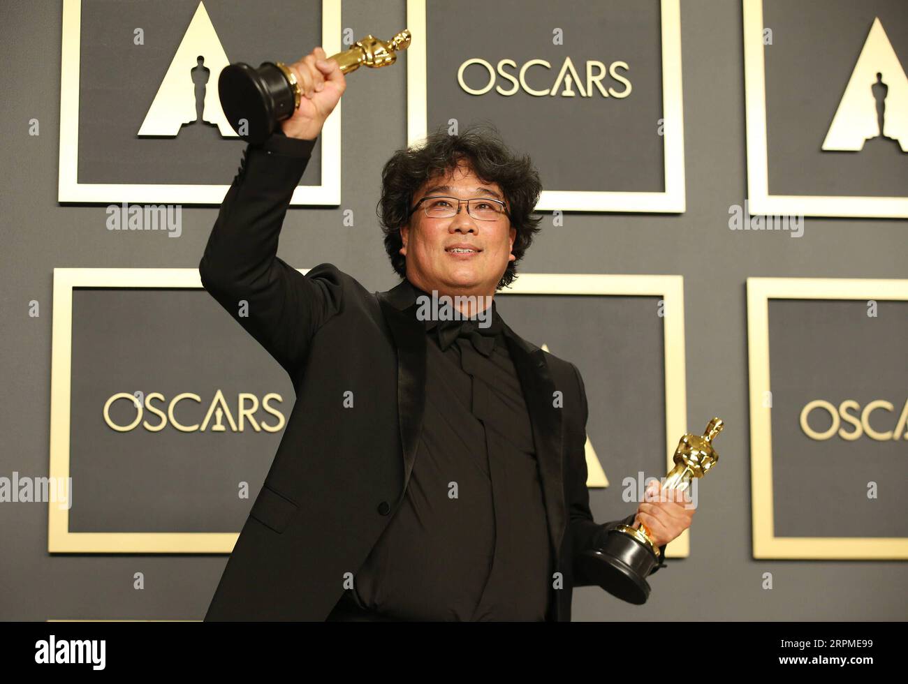 200210 -- LOS ANGELES, Feb. 10, 2020 -- Bong Joon-ho poses for photos at the 92nd Academy Awards ceremony at the Dolby Theatre in Los Angeles, the United States, Feb. 9, 2020. South Korean black comedy Parasite turned out to be the biggest winner at the 92nd Academy Awards ceremony on Sunday night. Besides nabbing Best Picture, the genre-bending class thriller also won Best Director for Bong Joon-ho, Best International Feature Film and Best Original Screenplay. Parasite also made history at the 92nd Academy Awards by becoming the first foreign-language film to win best picture.  U.S.-LOS ANGEL Stock Photo