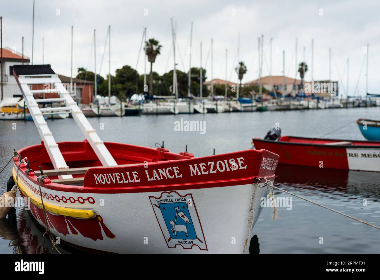 Boats used for jousting during summer festival, Port of Meze, Herault, Occitanie, France Stock Photo