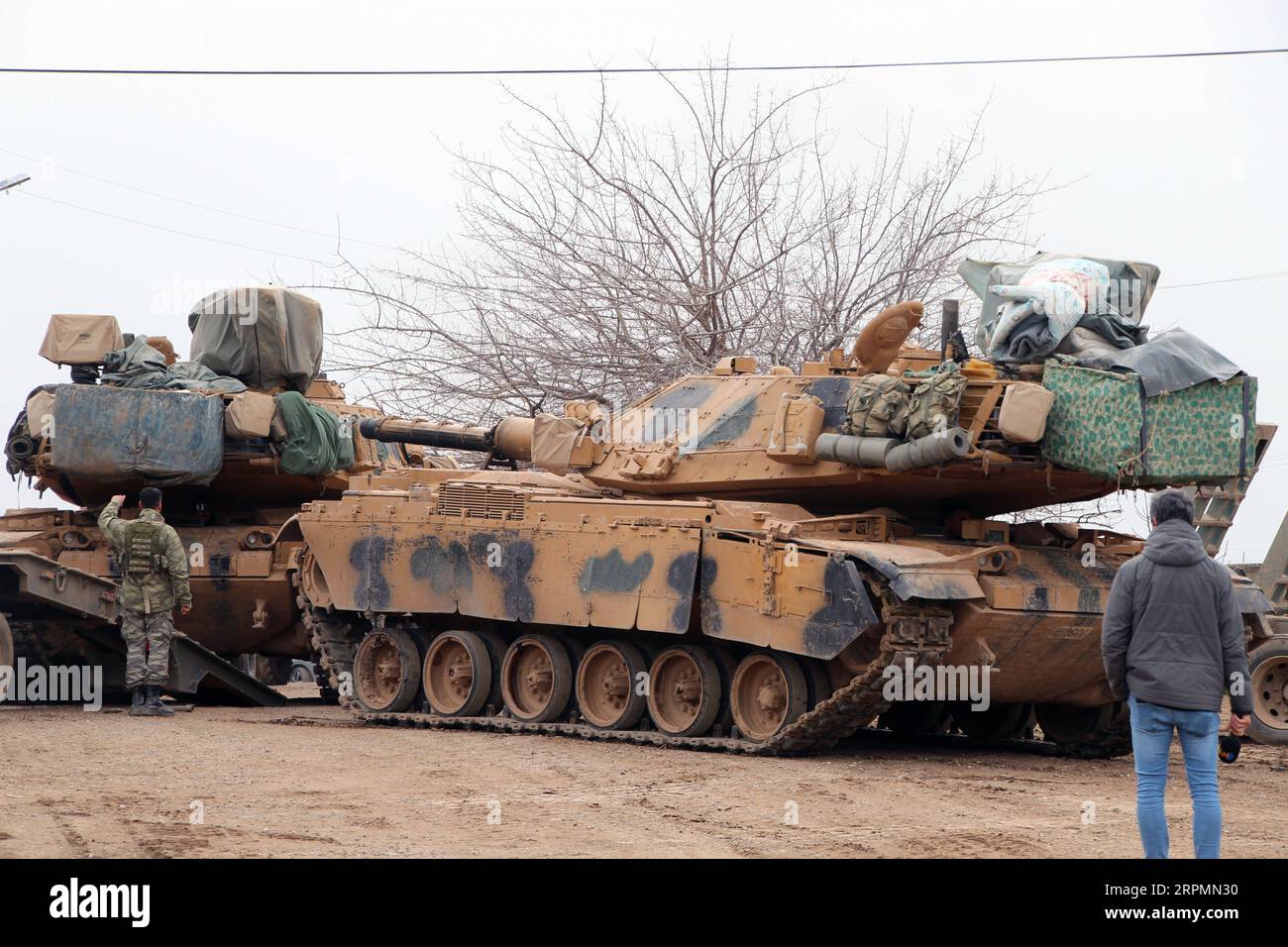 200214 -- ANKARA, Feb. 14, 2020 Xinhua -- Turkish tanks are seen in Reyhanli district of Hatay, Turkey, on Feb. 14, 2020. Turkey has poured in the last few days thousands of troops and convoys of military vehicles across the border, including tanks, armored personnel carriers and radar equipment in order to bolster its 12 observation posts. Photo by Mustafa Kaya/Xinhua TURKEY-HATAY-SYRIAN BORDER-MILITARY PRESENCE-INCREASING PUBLICATIONxNOTxINxCHN Stock Photo