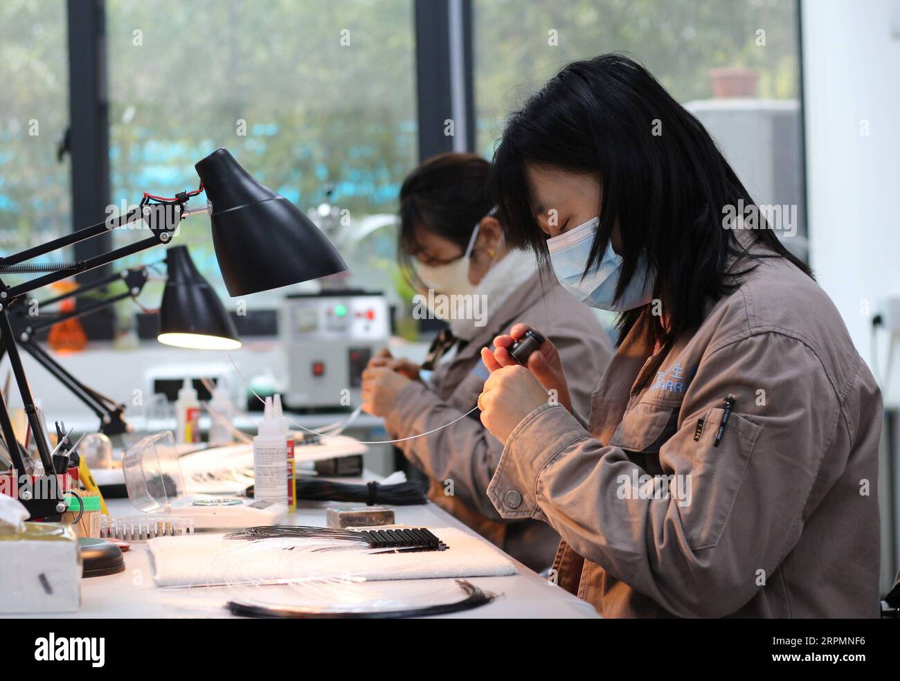 200215 -- NANJING, Feb. 15, 2020 -- Employees work at the Molarray Biotechnology Co. at Suzhou Industrial Park in Suzhou, east China s Jiangsu Province, Feb. 7, 2020. Xinhua Headlines: Chinese firms boost immunity to coronavirus fallout LixBo PUBLICATIONxNOTxINxCHN Stock Photo