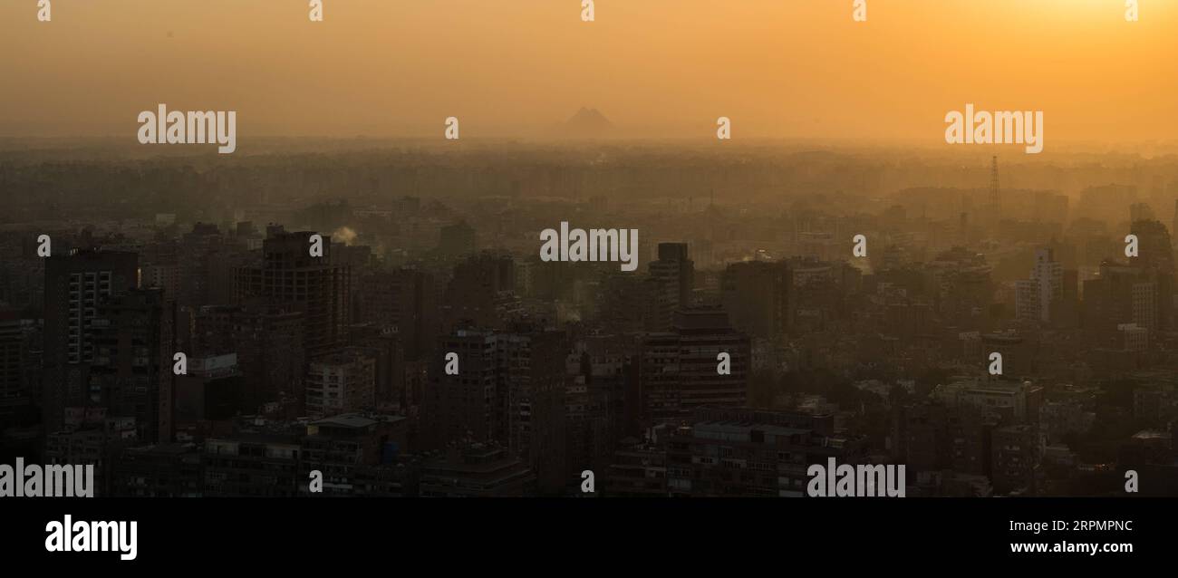 200216 -- CAIRO, Feb. 16, 2020 -- A view of the Giza Pyramids and buildings in Giza province is seen from the Cairo Tower in Cairo, Egypt, Nov. 24, 2019. Due to an outbreak of the novel coronavirus pneumonia, which originated in China s central city of Wuhan late last year, many Chinese tourists who had planned to travel abroad during the week-long Spring Festival holiday chose instead to stay at home. Despite the apparent impact from the declining number of Chinese visitors right now, the Egyptian people have expressed their confidence in China s ability to overcome the disease and voiced hop Stock Photo
