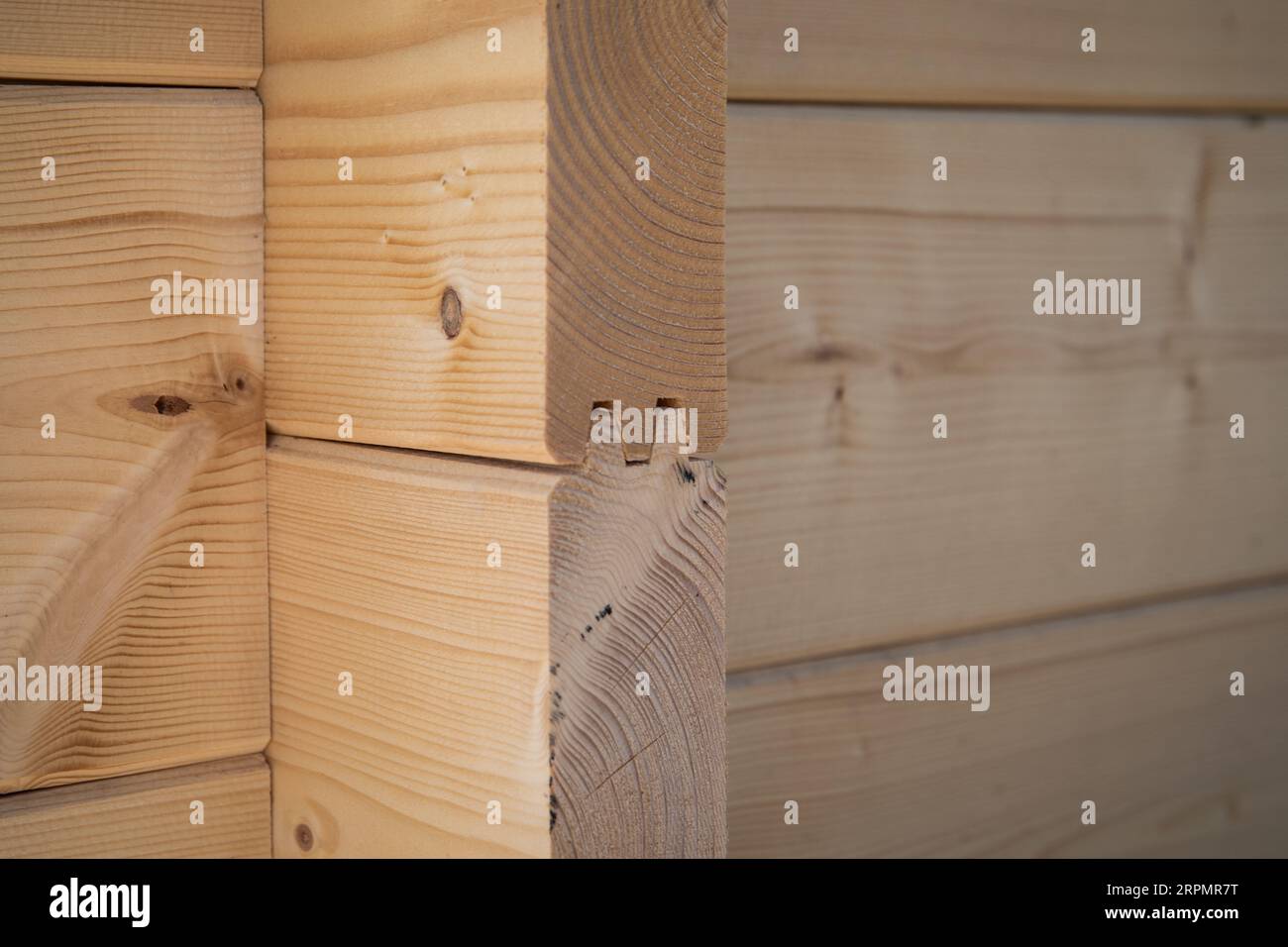 Construction of a wooden farm building. Milled wooden log Stock Photo ...