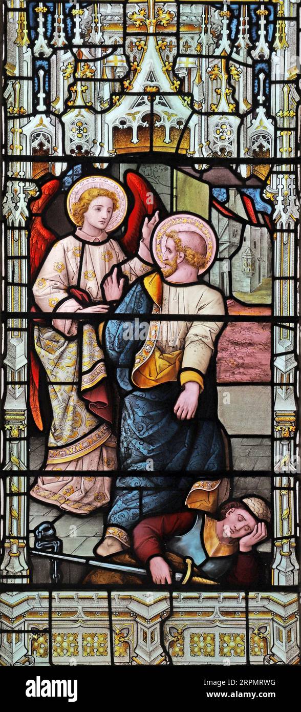 A stained glass window depicting the Liberation from prison of the Apostle Saint Peter, Church of St Peter ad Vincula, Coggleshall, Essex Stock Photo