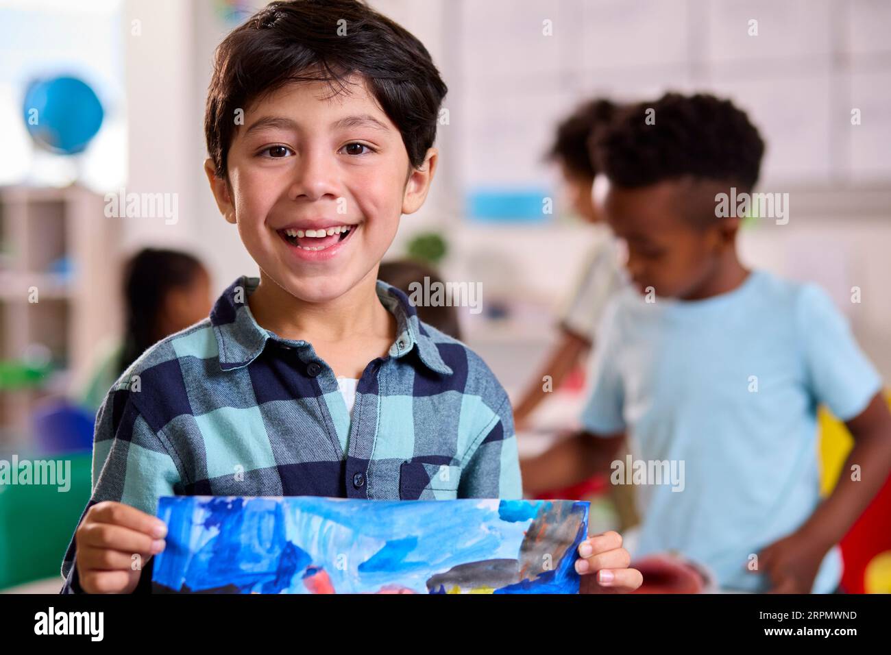 Classroom Portrait Of Smiling Male Elementary School Pupil In Art Class ...