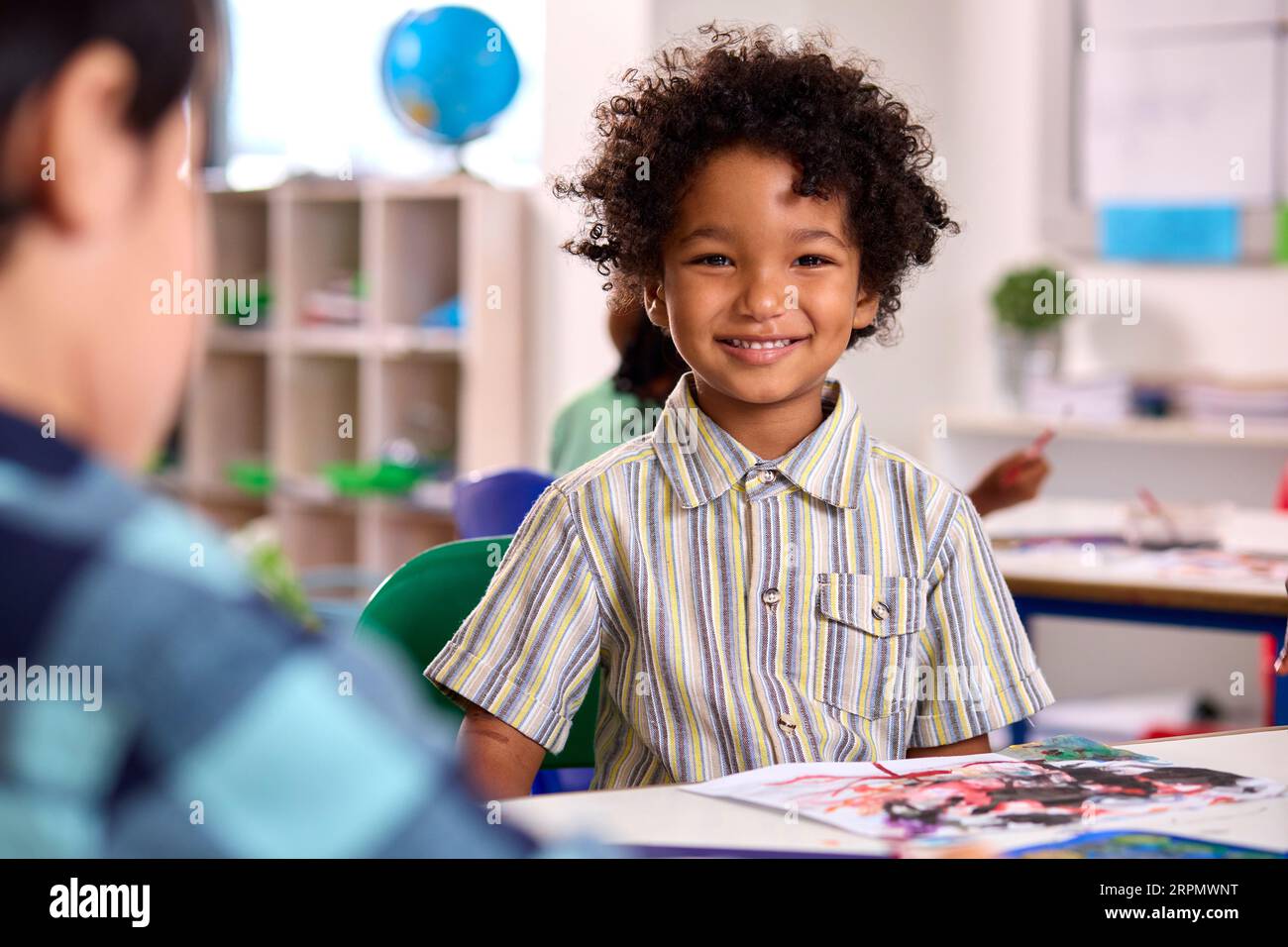 Classroom Portrait Of Smiling Male Elementary School Pupil In Art Class ...