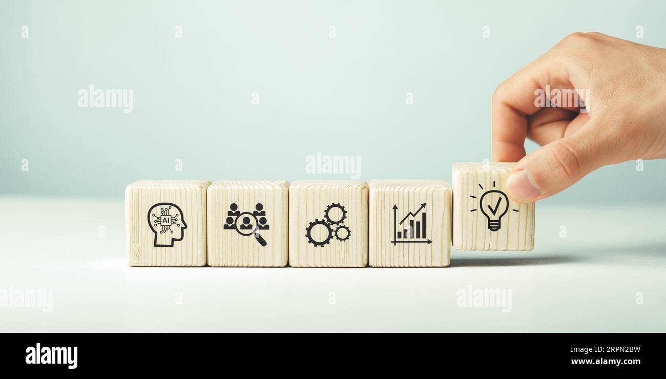 Assembled wooden cubes on the theme of business ideas. Stock Photo