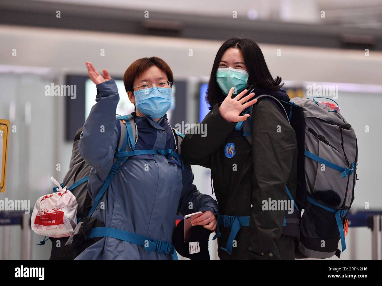 200220 -- TIANJIN, Feb. 20, 2020 -- Medical team members bid farewell before leaving for Hubei Province at Binhai International Airport in Tianjin, north China, Feb. 20, 2020. The 11th batch of medical team comprised of 172 medical personnel from Tianjin set off on Thursday to aid the coronavirus control efforts in Hubei. Previously a total of 1,073 medical workers from Tianjin have assisted Hubei in the anti-virus fight.  CHINA-TIANJIN-NCP-MEDICAL TEAM-AID CN LixRan PUBLICATIONxNOTxINxCHN Stock Photo