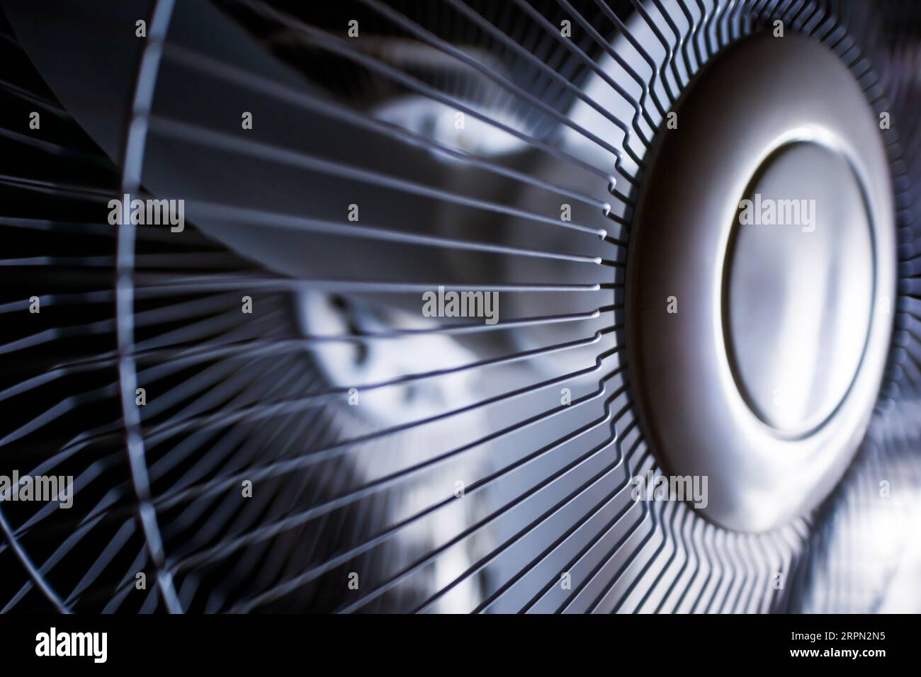 White electric domestic fan, closeup macro view, dark background Stock Photo