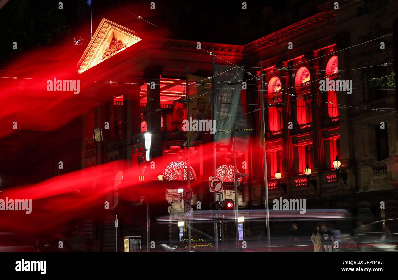200222 -- SYDNEY, Feb. 22, 2020 -- Melbourne Town Hall is lit up in red in Melbourne, Australia, Feb. 21, 2020. As China is fighting the outbreak of COVID-19, the Victorian state government of Australia launched a new campaign on Thursday to show their support for the Chinese communities at home and abroad. As part of the campaign, a number of Victoria landmarks, including the Arts Center, National Gallery of Victoria, Melbourne Museum, Melbourne Town Hall and Flinders Street Station, were be lit up in red and gold on Friday as a symbol of solidarity with Chinese Victorians.  AUSTRALIA-MELBOUR Stock Photo