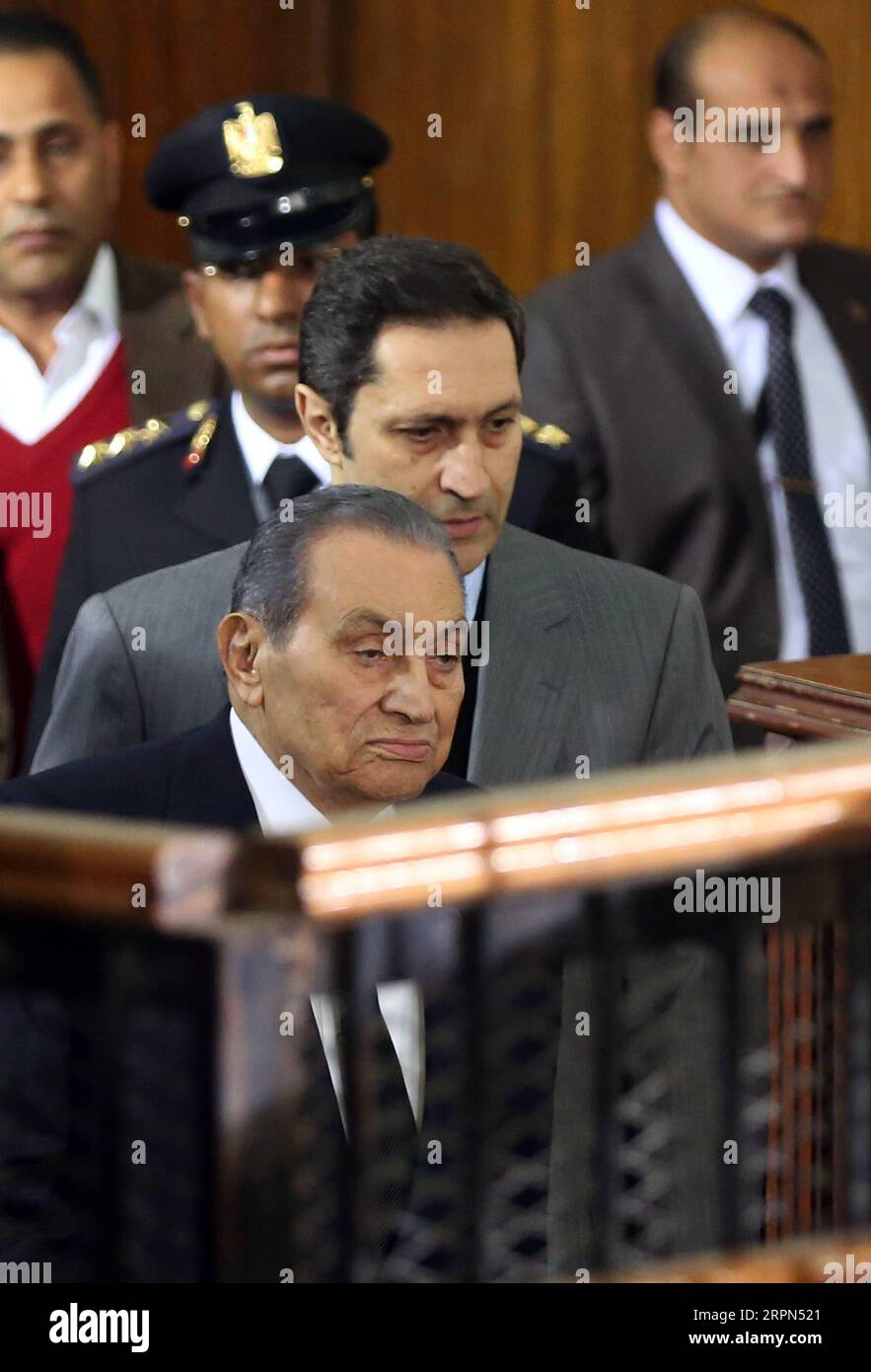 200222 -- CAIRO, Feb. 22, 2020 -- File photo taken on Dec. 26, 2018 shows Alaa Mubarak 2nd R and his father, ousted Egyptian president Mohamed Hosni Mubarak front, in a court in Cairo, Egypt. An Egyptian court acquitted on Saturday Alaa and Gamal Mubarak, the sons of ousted Egyptian president Mohamed Hosni Mubarak, in a corruption case, state-run Ahram Online news website reported.  EGYPT-CAIRO-SONS OF EX-PRESIDENT MUBARAK-CORRUPTION CHARGES AhmedxGomaa PUBLICATIONxNOTxINxCHN Stock Photo