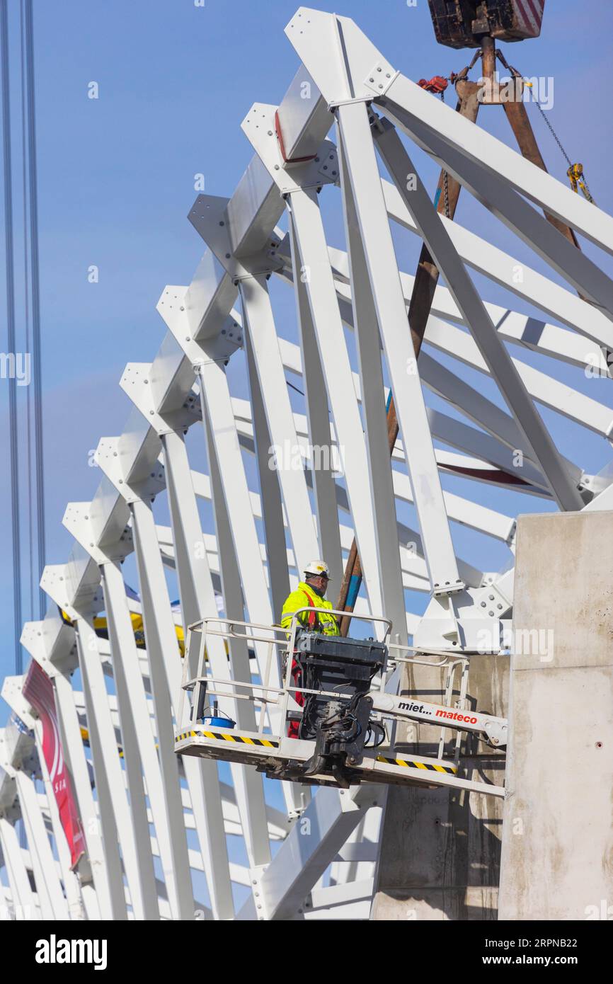 Assembly of the 105-metre-long light ring girder above the north stand of the Heinz Steyer Stadium Stock Photo