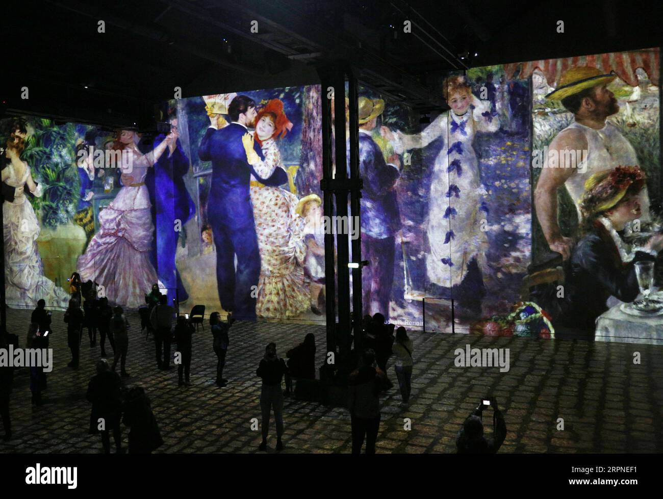 200227 -- PARIS, Feb. 27, 2020 -- People visit the digital exhibition titled Monet, Renoir...Chagall: Journeys around the Mediterranean during a press review in Paris, France, Feb. 27, 2020. The digital exhibition to be held from Feb. 28, 2020 to Jan. 3, 2021 presents visitors with an itinerary that spans the period between Impressionism and modernism. The exhibition immerses visitors in the masterpieces of 20 artists, including Renoir, Monet, Matisse, Chagall etc., and highlights the link between artistic creativity and the Mediterranean shores.  FRANCE-PARIS-DIGITAL EXHIBITION GaoxJing PUBLI Stock Photo