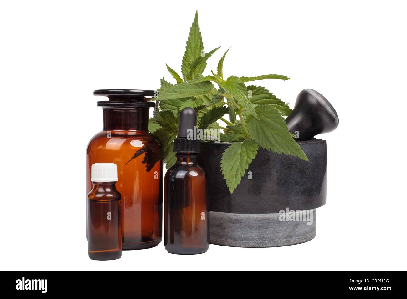Natural Medicine: Mortar with Nettle and Medical Bottles Stock Photo