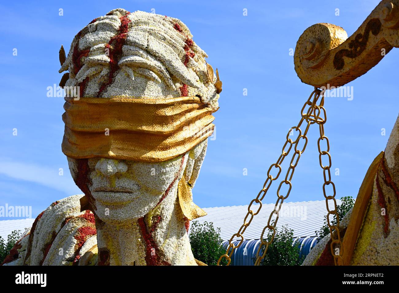 Lady Justice with blindfold and scales; one of the colourful floats of