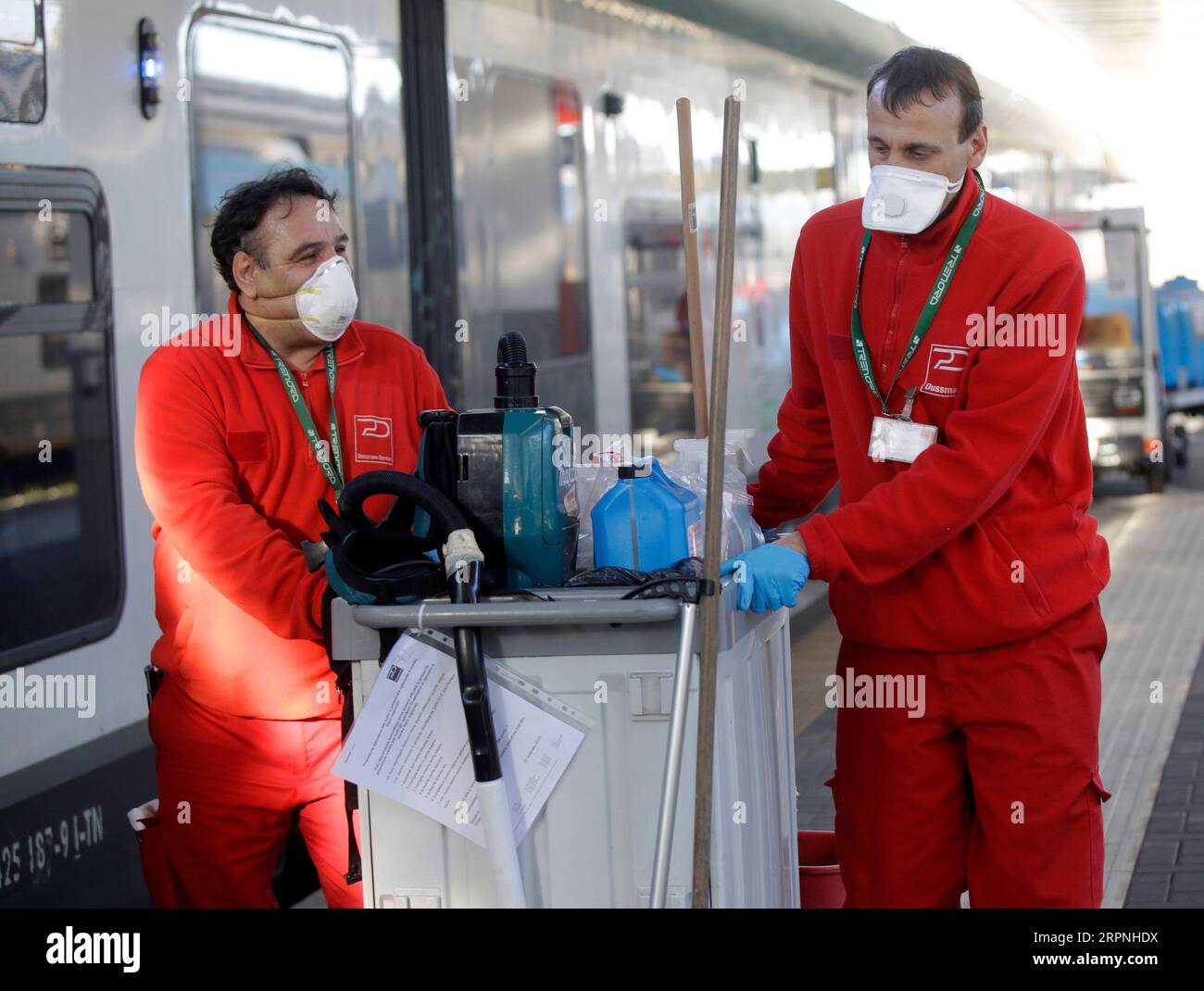 200229 -- MILAN, Feb. 29, 2020 Xinhua -- Staff members sanitize the facilities on a train at the Garibaldi train station in Milan, Italy, Feb. 28, 2020. The total number of confirmed COVID-19 cases in Italy have increased to 888, including 21 fatalities and 46 recoveries, according to the Ministry of Health on Friday. Photo by Alberto Lingria/Xinhua ITALY-MILAN-COVID-19 PUBLICATIONxNOTxINxCHN Stock Photo