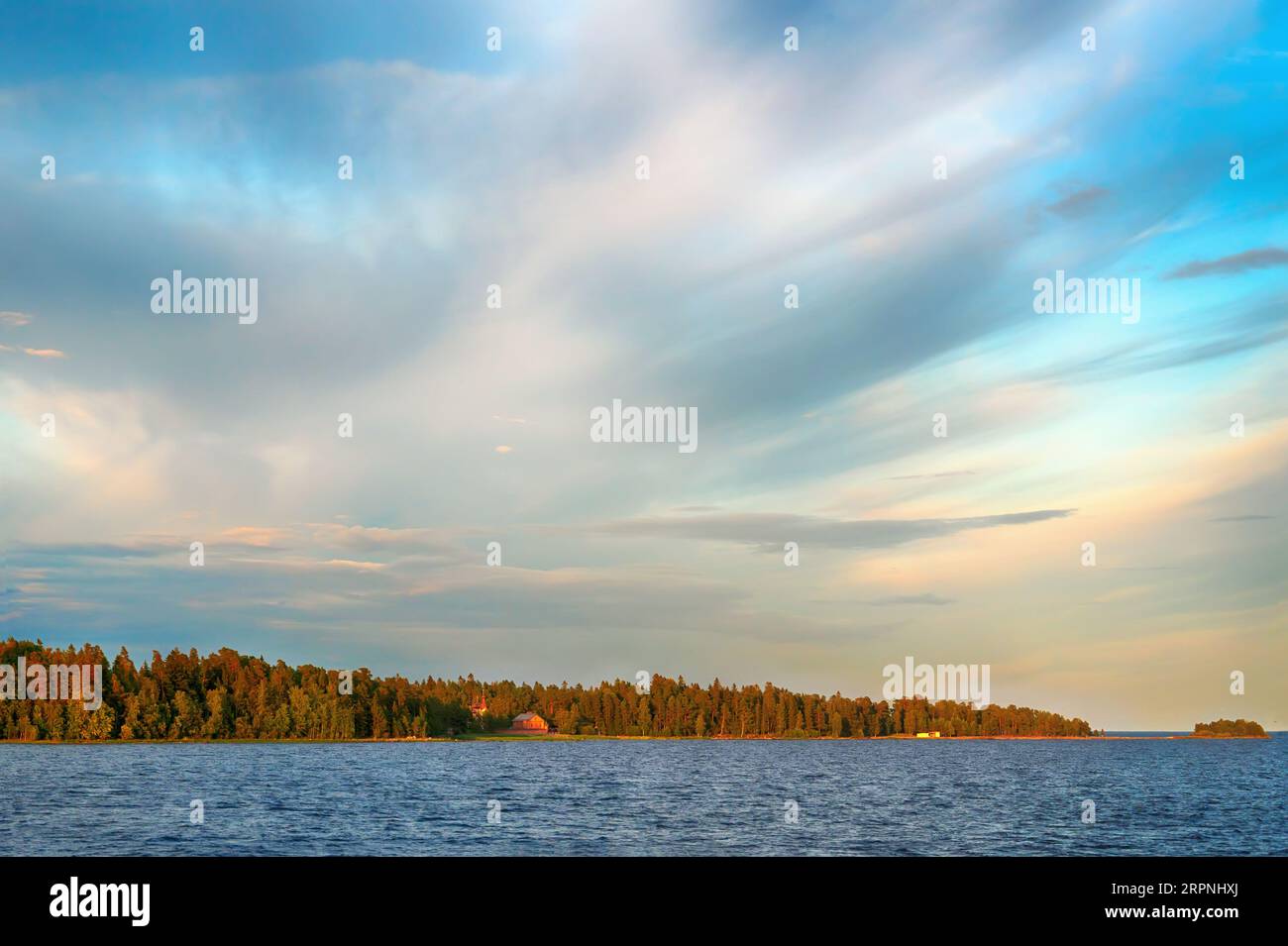 View of Konevets Island, Konevsky Skete at sunset from Lake Ladoga. Stock Photo