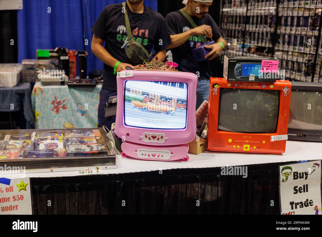 Pink and Orange CRT adorn an exhibit at Retro World Expo, a vintage