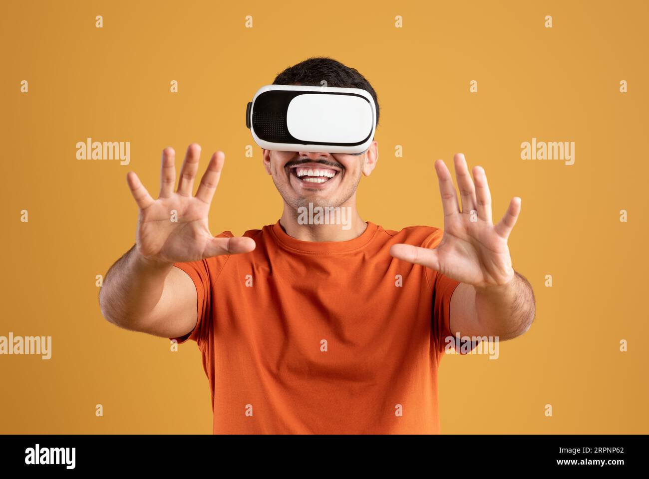 Playing mobile game applications on device. Excited man experiencing virtual reality in vr